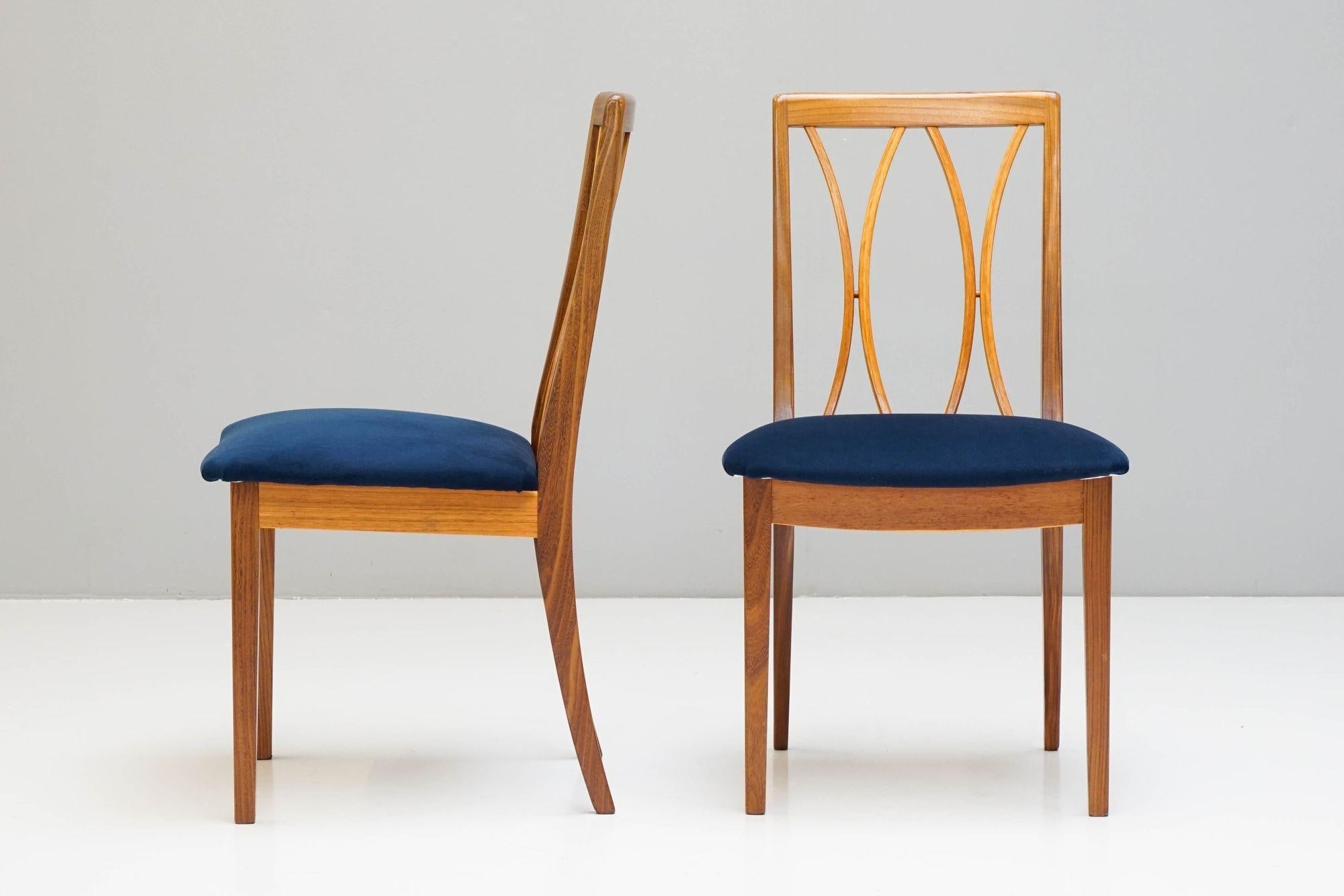 Set of four mid-century dining chairs by G-Plan, newly upholstered in blue velvet.
H 87cm x W 48cm x D 52cm x SH 46cm.
Please be in contact before purchase, so we can give an accurate delivery quote.