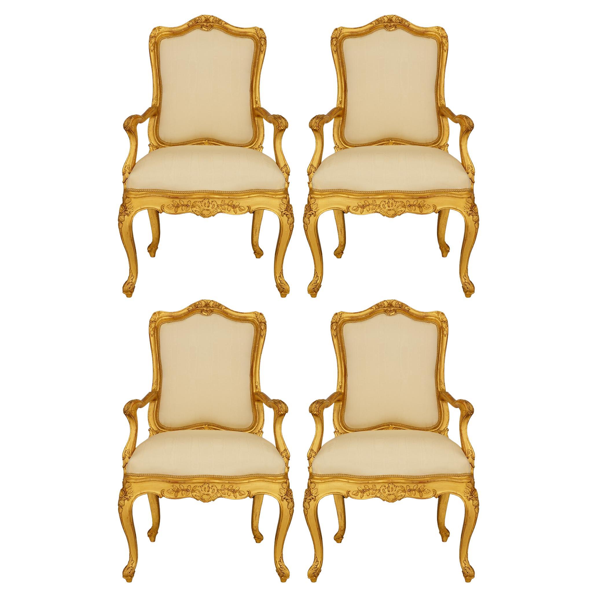 set of four Genovese 19th century Louis XV st. Giltwood armchairs