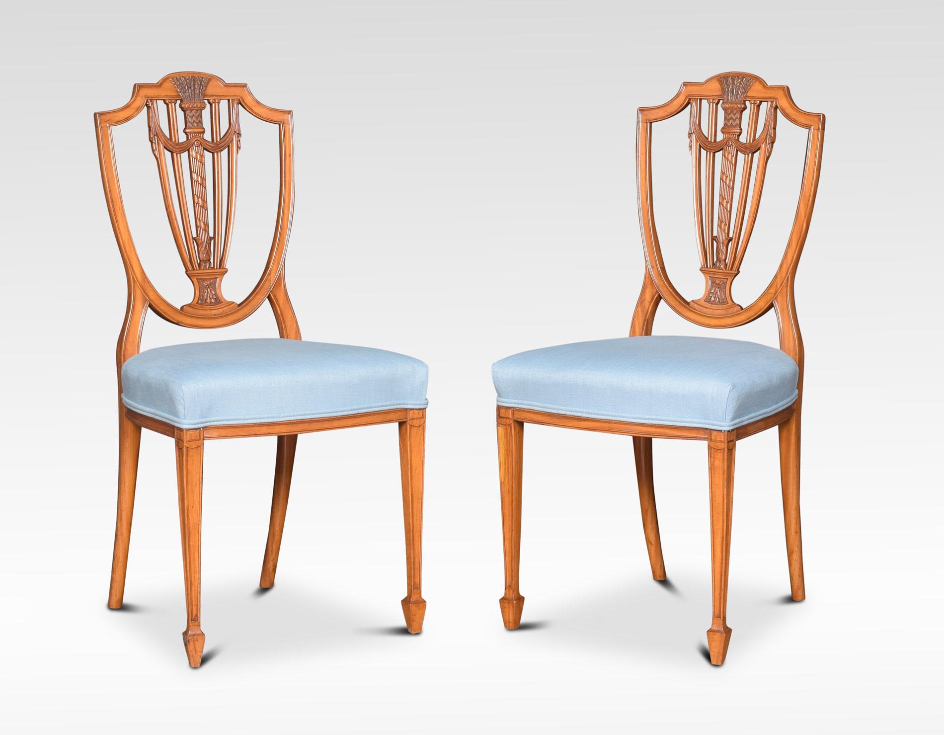 Set of four Georgian revival satinwood side chairs, the open shield back with a pierced splat. To the overstuffed seat raised on square tapering legs terminating in spade feet.
Dimensions:
Height 37 inches height to seat 19 inches
Width 17.5