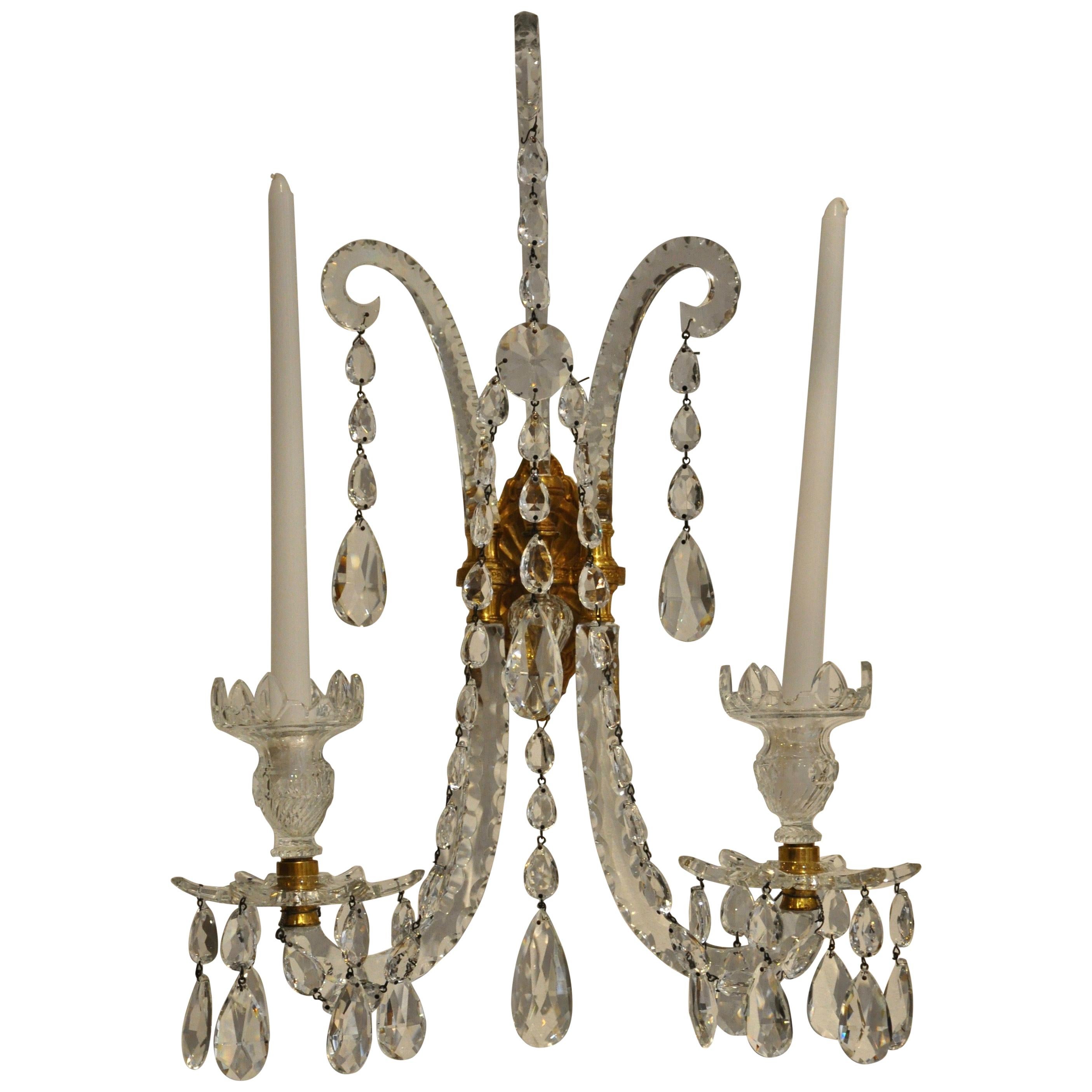 Set of four Georgian sconces of gilt brass with handcut crystal arms and features

--Wonderful set of four matching Georgian two light wall sconces
--possible retailed by Nesle, NY

--can be French wired at customer's request.