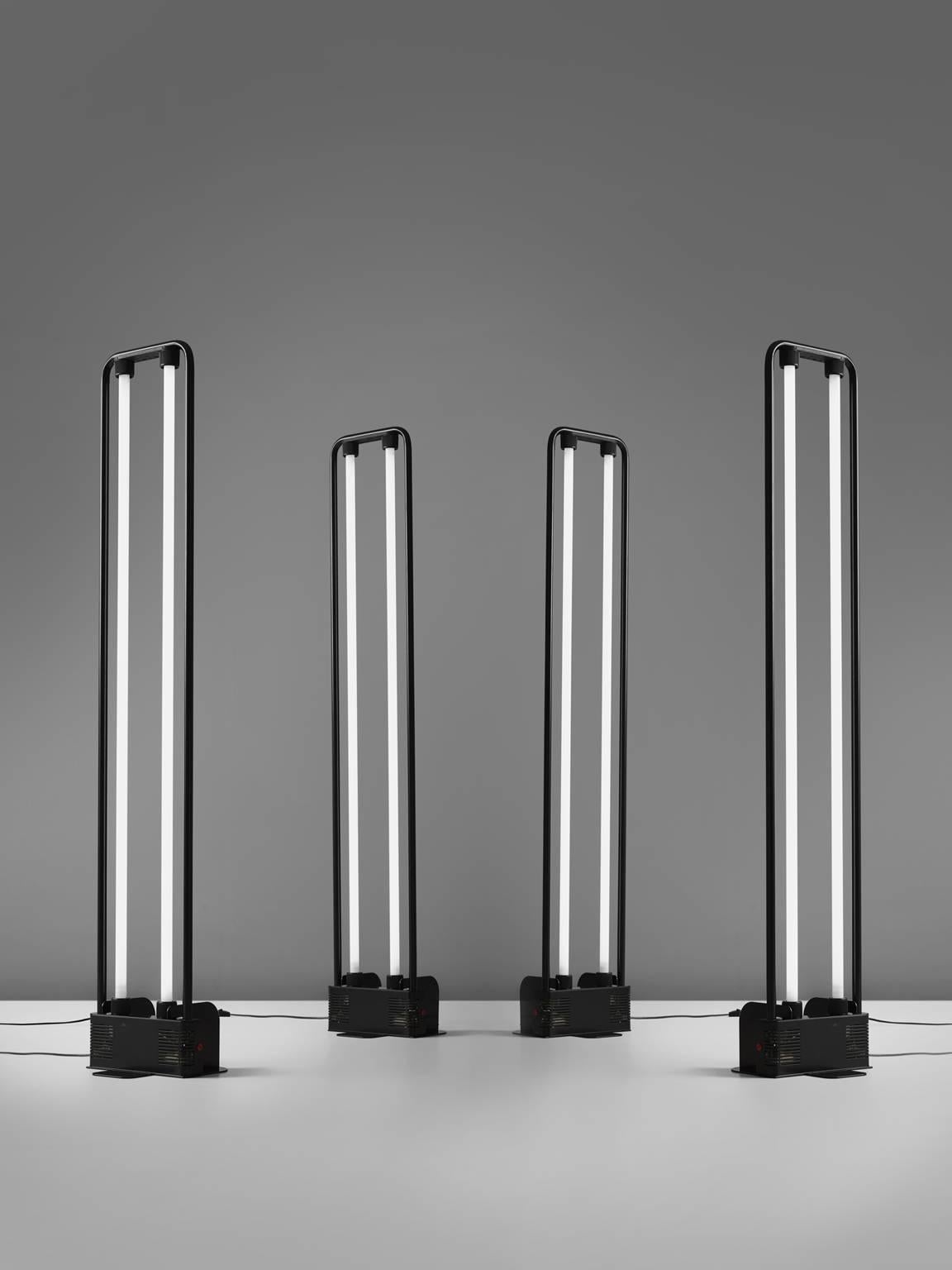 Gian Nicola Gigante for Zerbetto, four floor lamps, black coated metal and glass, Italy, 1980s. 

These Postmodern floor lamps are designed by Italian designer Gian Nicola Gigante. Gigante is known for his fluorescent floor lamps. These lights are