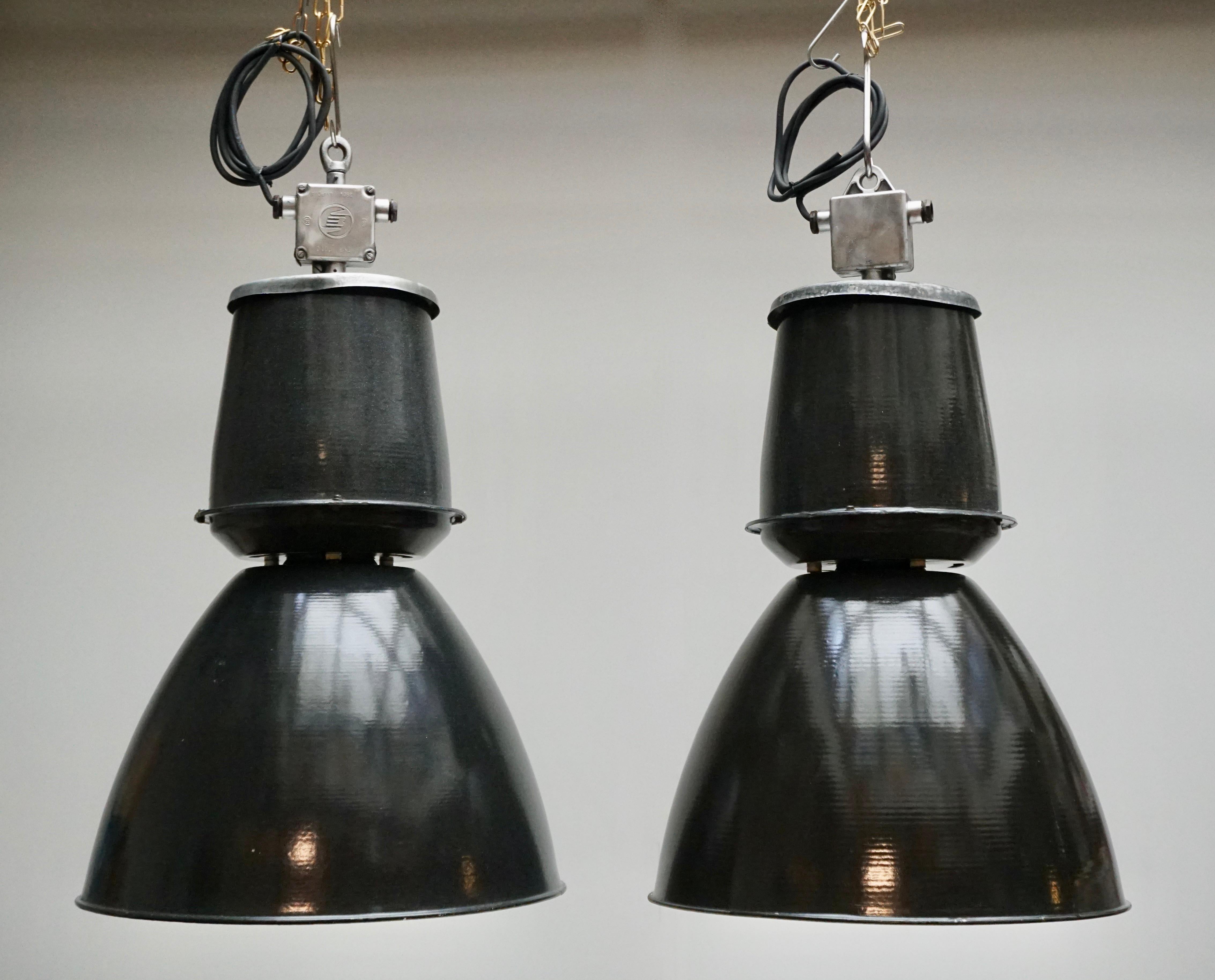 Eight Industrial down-lighters from the 1940s. Completely enameled inside and out. Greyish black on the outside, white on the inside. Great looking in a bar, a loft or over your kitchen table!
Diameter:53 cm.
Height:92 cm.