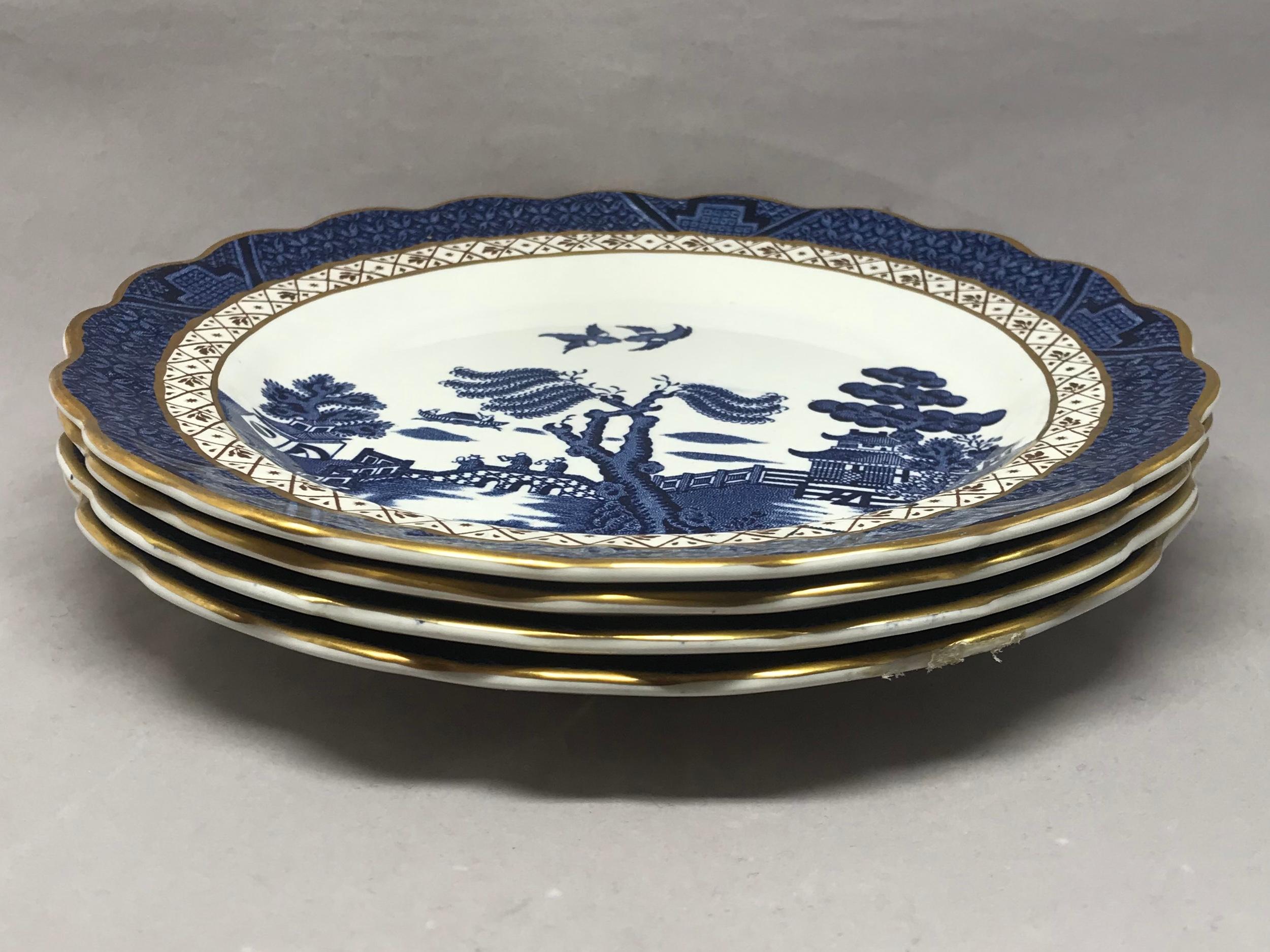 Set of four gilded blue and white chinoiserie dessert plates. Set of four English 