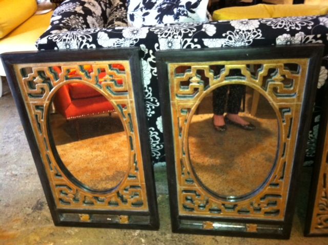 Beautiful set of Chinese mirrors. Hand carved, gilded frames with antiqued mirrors and black accents. The two large mirrors measure 17