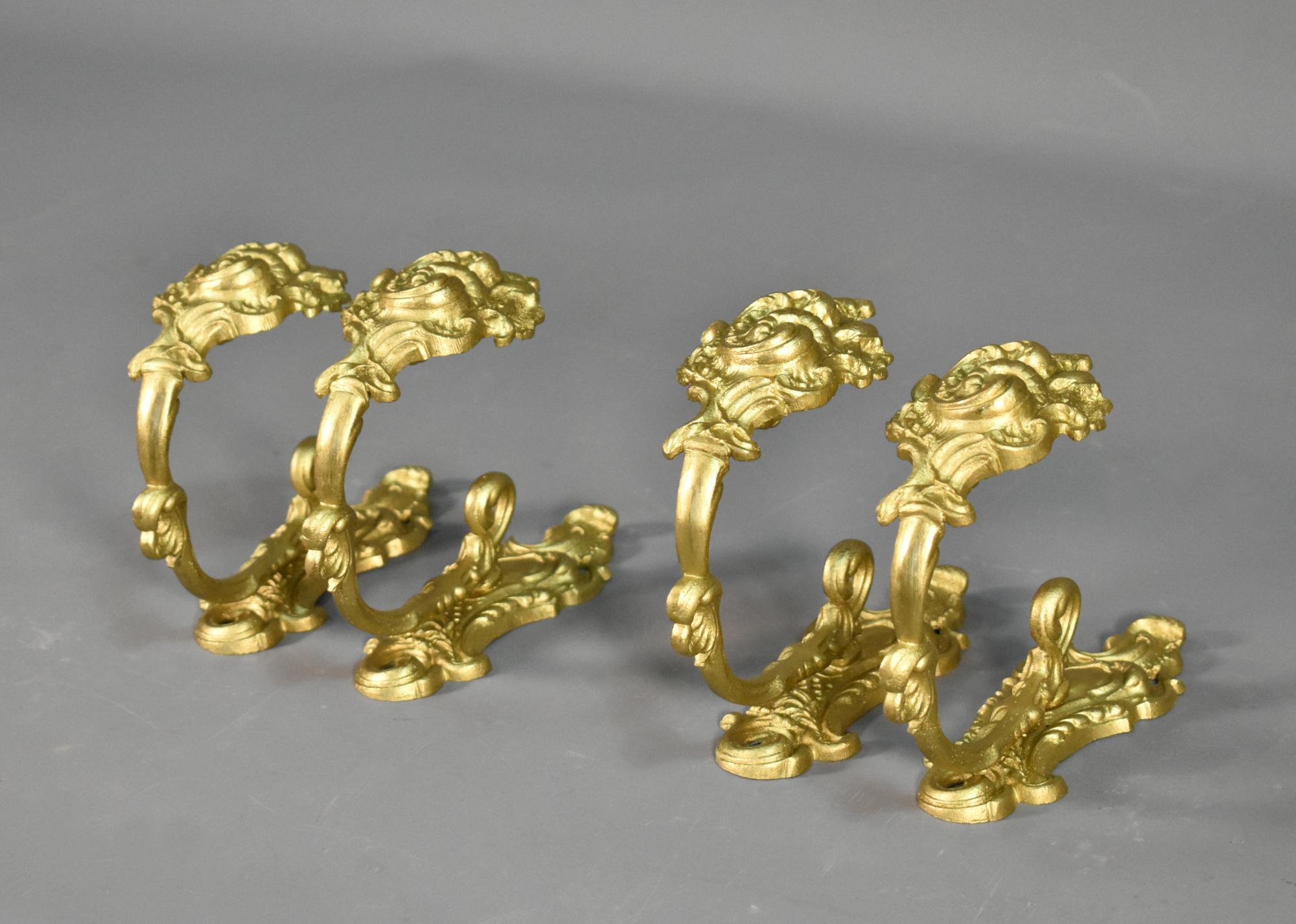 Set of Four Gilt Bronze Curtain Tie-Backs Louis XV Style 

An impressive and beautiful cast set of four French curtain tie-backs in gilt bronze, decorated with floral motifs and flowing C scrolls. 

On the rear they are marked with the