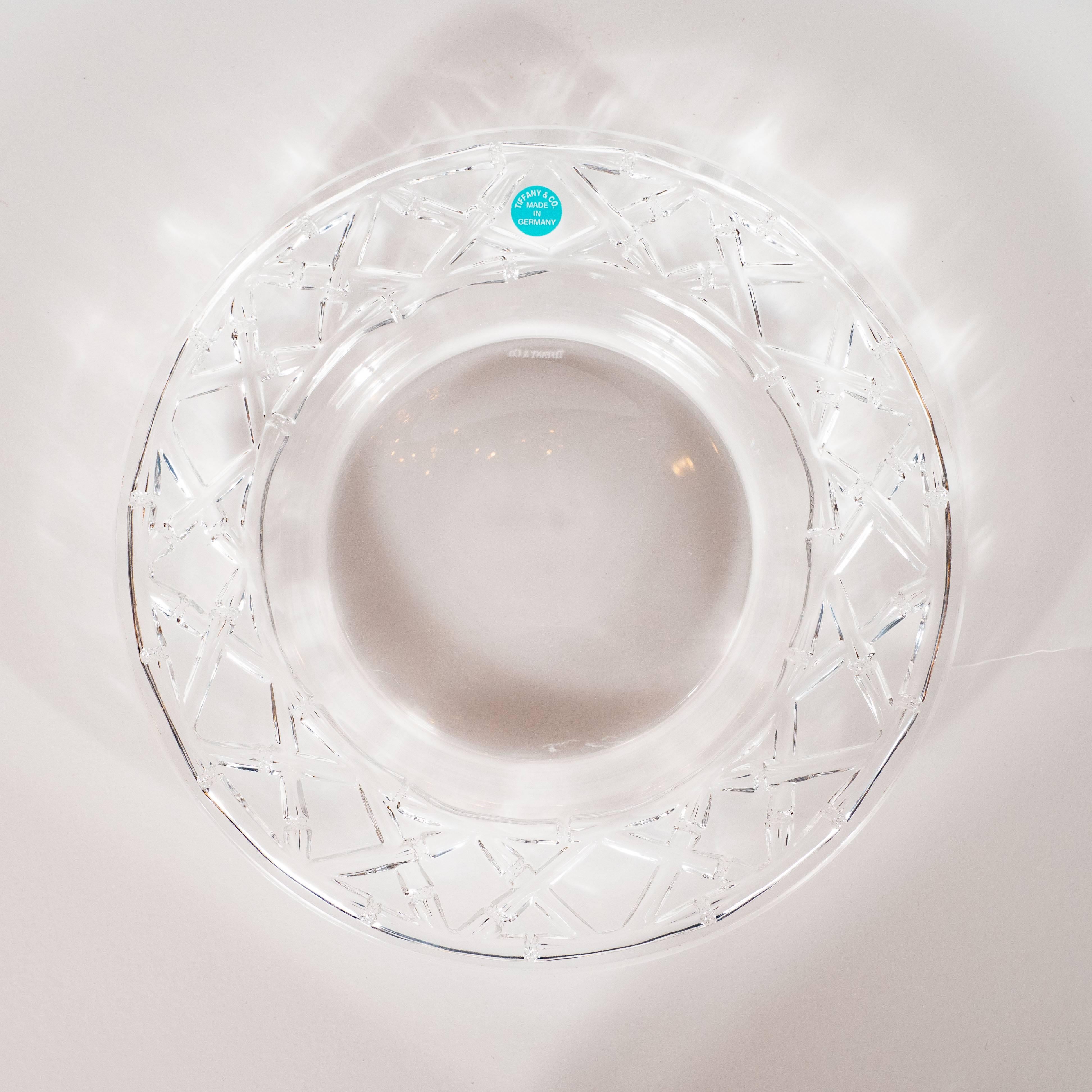 This stunning set of four Dessert/Hors D'oeuvres plates were designed by the fabled American maker- Tiffany & Co. and custom crafted in Germany. They feature a basketweave pattern etched into the bottom of the outer ring of each plate, resembling