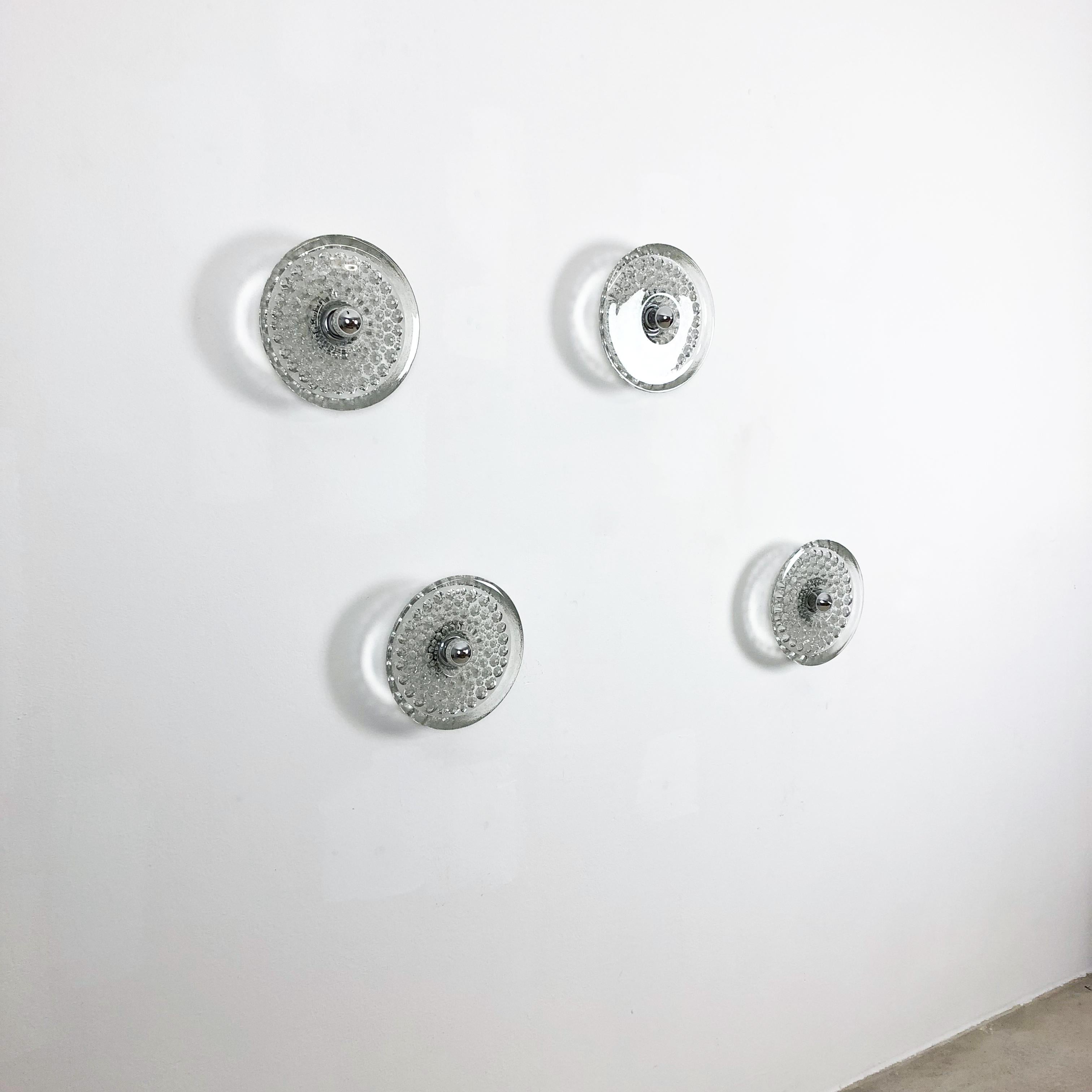 Article:

wall light set of four


Producer:

Peill and Putzler, Germany


Origin:

Germany



Age:

1970s



Original 1970s modernist German wall Light set made of glass and metal. These super rare wall lights were produced in