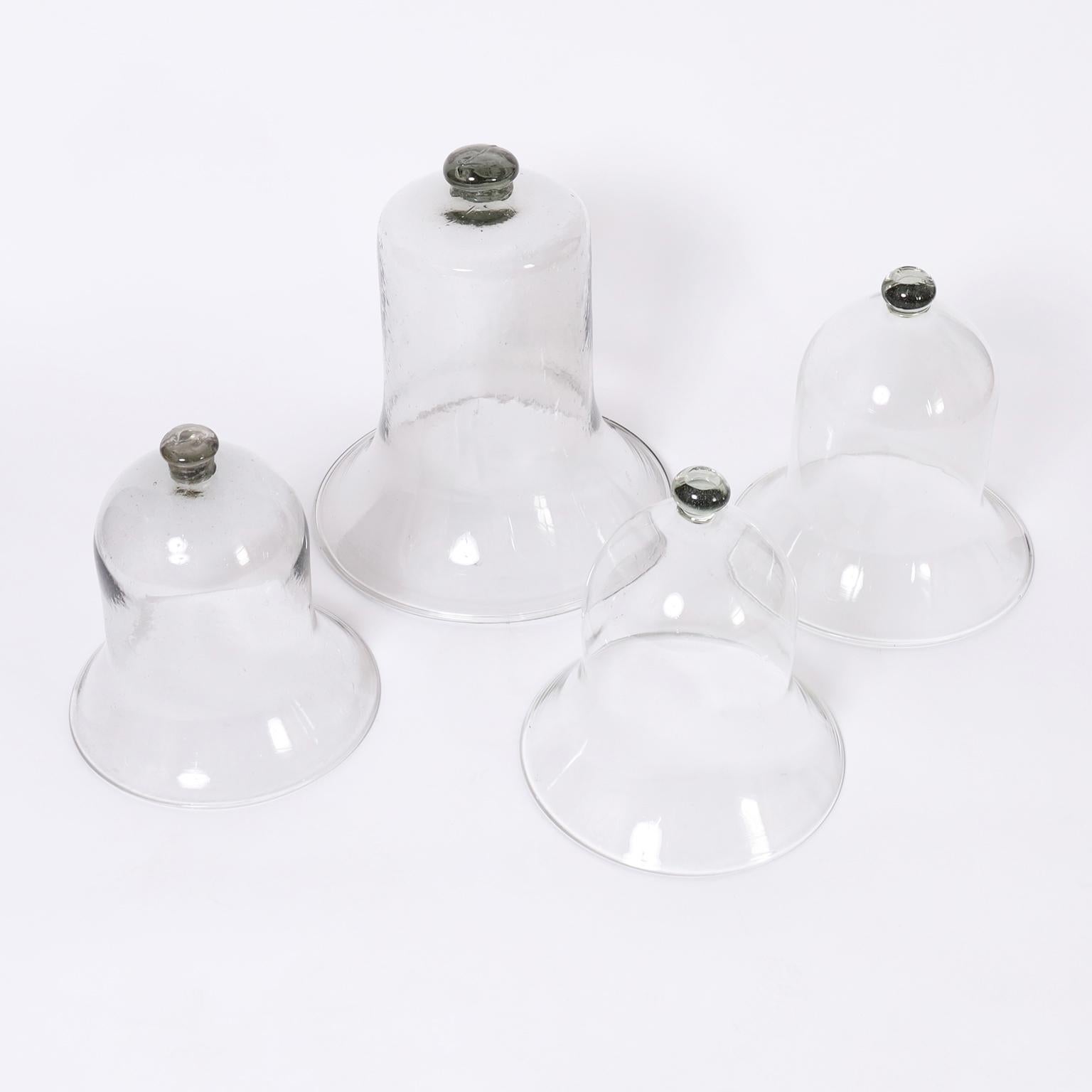 For the gardener with panache, a set of four hand blown glass cloches in classic bell form. Priced Individually.

Left: H: 13 DM: 12 $525.00
Middle: H: 18 DM: 16 $825.00
Right (Pair): H: 14 DM: 13 $1,150.00
