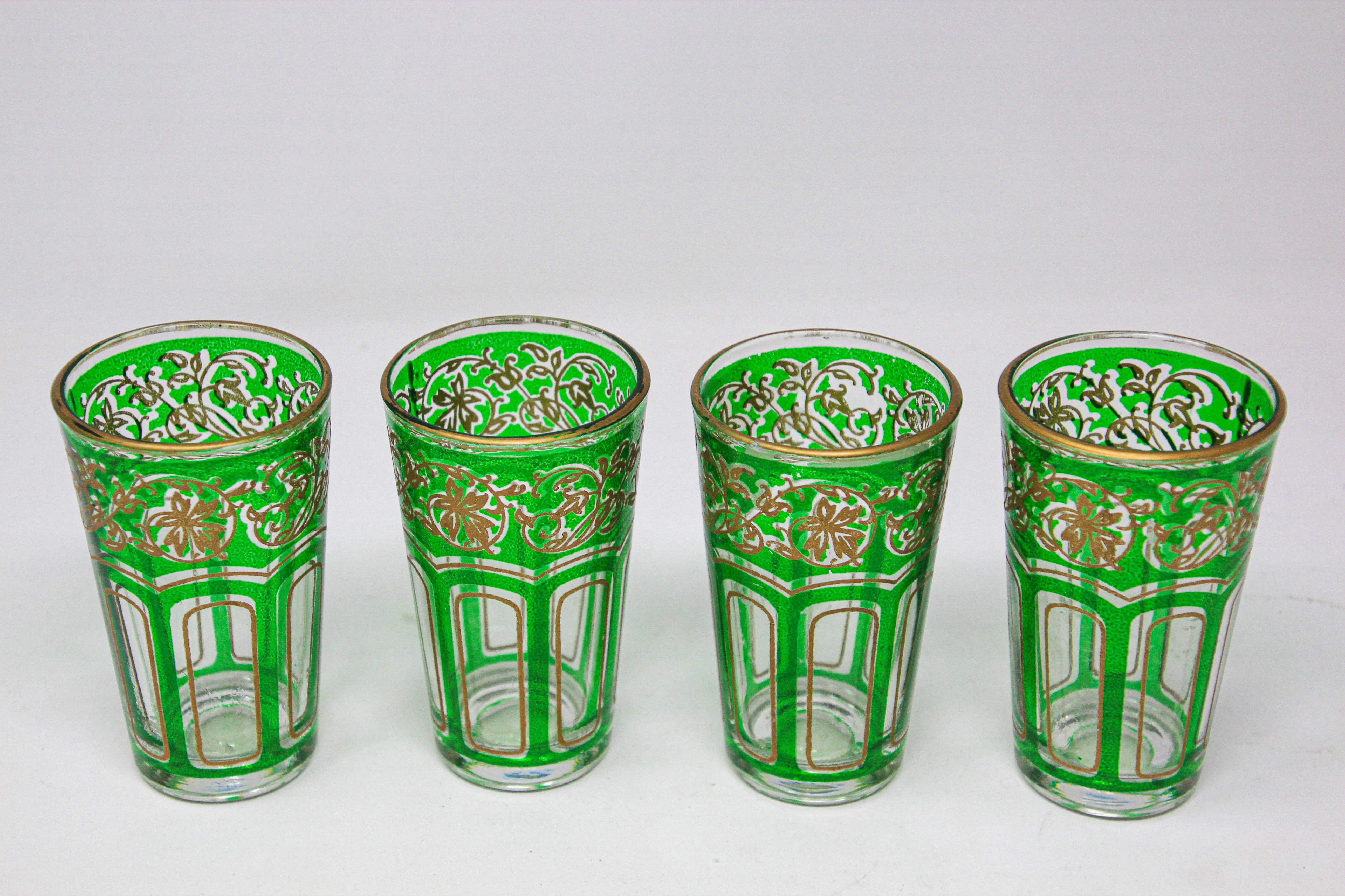 Set of four Moroccan emerald green glasses with gold raised Moorish design.
Decorated with a classical gold and pattern Moorish frieze.
Use these elegant vintage glasses for Moroccan tea, or any hot or cold drink.
Perfect for the holidays and