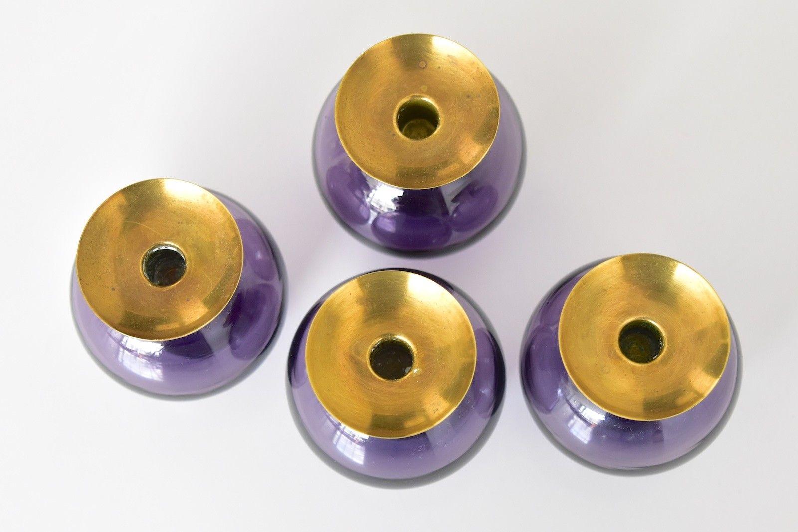 Nice set of four Gunnar Ander candle sticks by Lindshammar Glasbruck Sweden in 1950s. Candleholder with purple transparent glass and brass candleholder. The price is for the set.