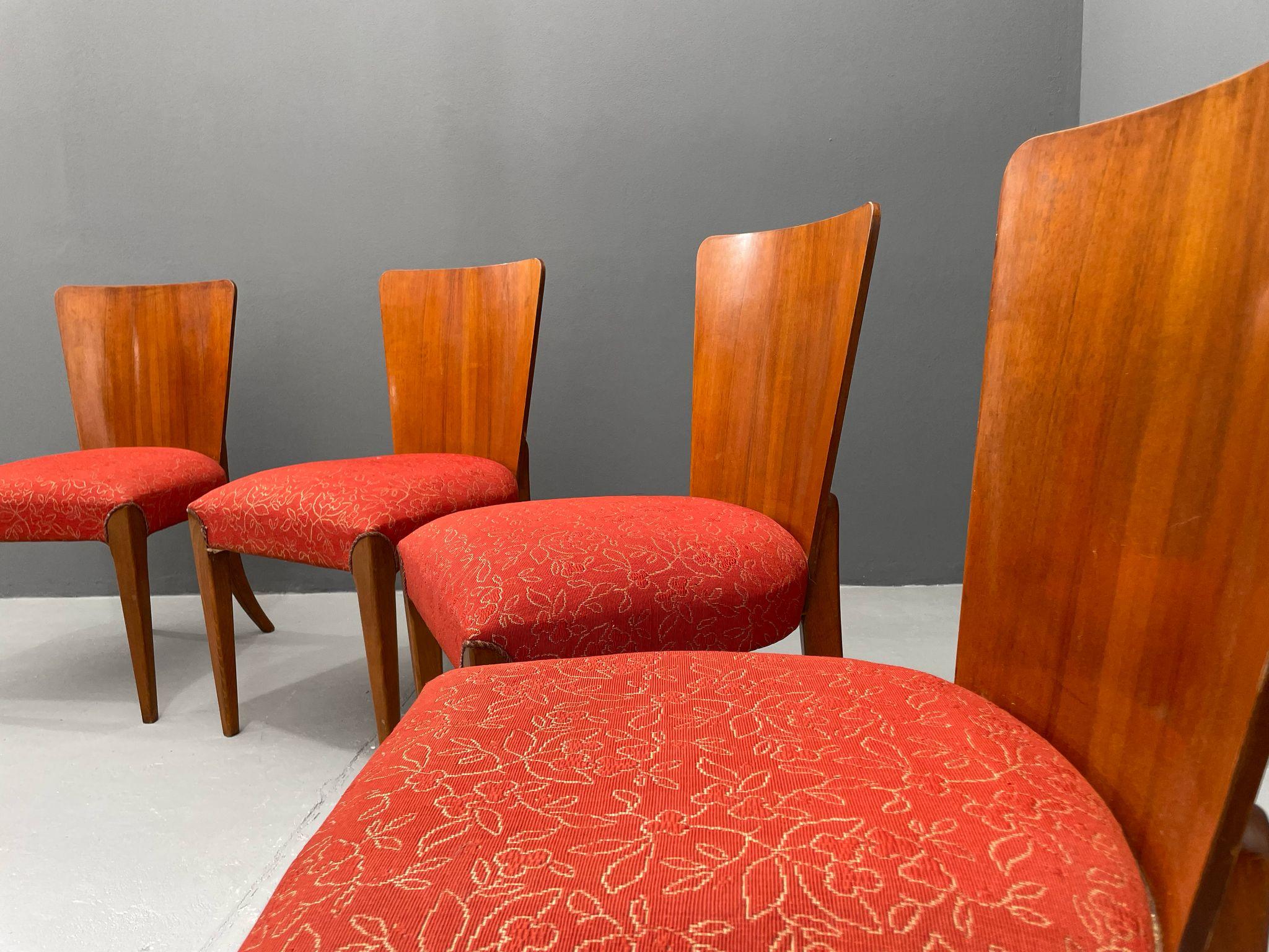 We offer a set of four dining chairs, model H-214, designed by prominent Czech designer Jindřich Halabala (1903–1978). These were produced by the United Arts and Crafts Factories in Brno during the 1950s, based on a model originally created in the