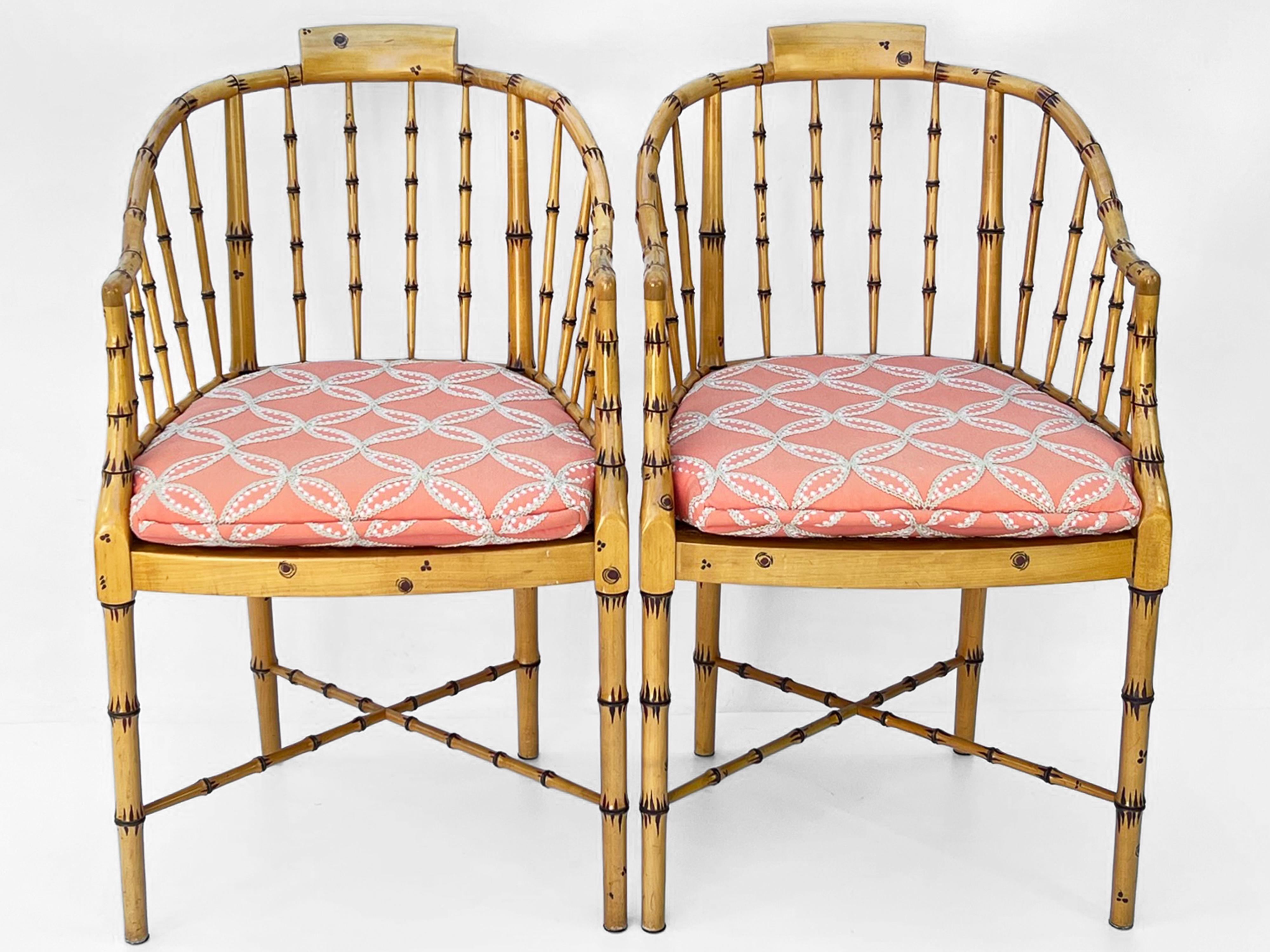 A set of four vintage faux bamboo hand painted tub-style armchairs by Baker. Each chair having caned seats with a loose custom cushion, raised on round legs, joined by X-stretcher. 

Please contact us for alternative shipping quotes.

Stock ID: