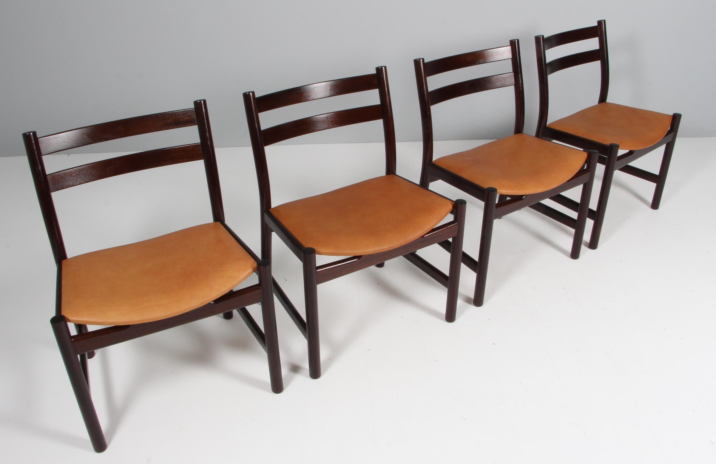 Set of four Hans J. Wegner dining chairs in mahogany

New upholstetred with vintage tan aniline leather.

Made by Carl Hansen, model CH47


Hans J. Wegner was born in 1914 in Tønder in Southern Denmark, the son of a Shoemaker. At the age of 17, he