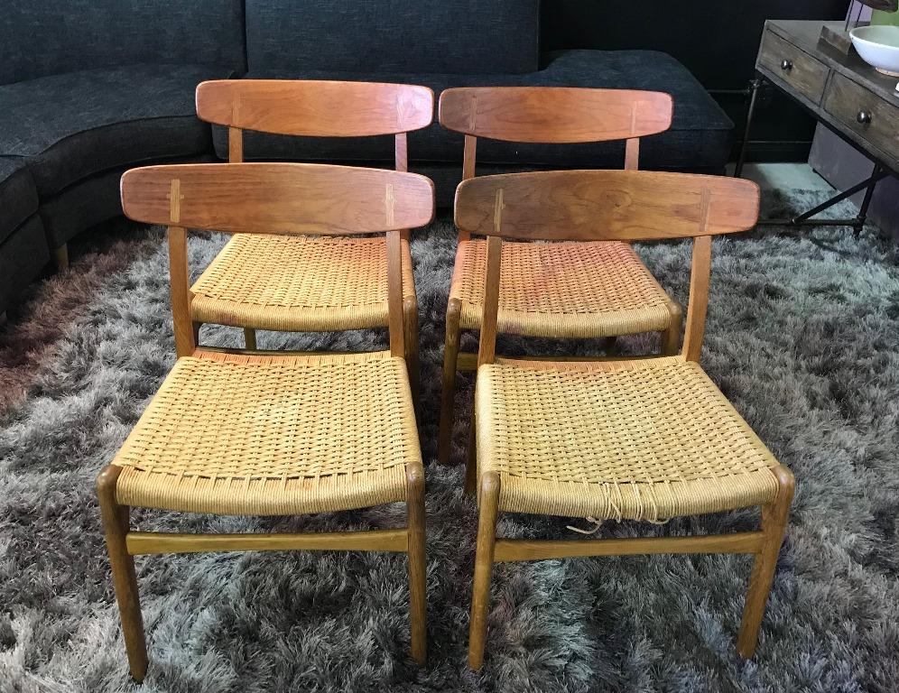 Iconic in design and aesthetic. First introduced in 1950 by famed Danish designer Hans Wegner, these CH23 chairs features refined styling and masterful craftsmanship and are immediately recognizable with their curved seat backs and 
