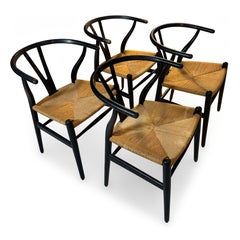Juego de cuatro sillas de comedor Hans Wegner Wishbone de Carl Hansen & Søn