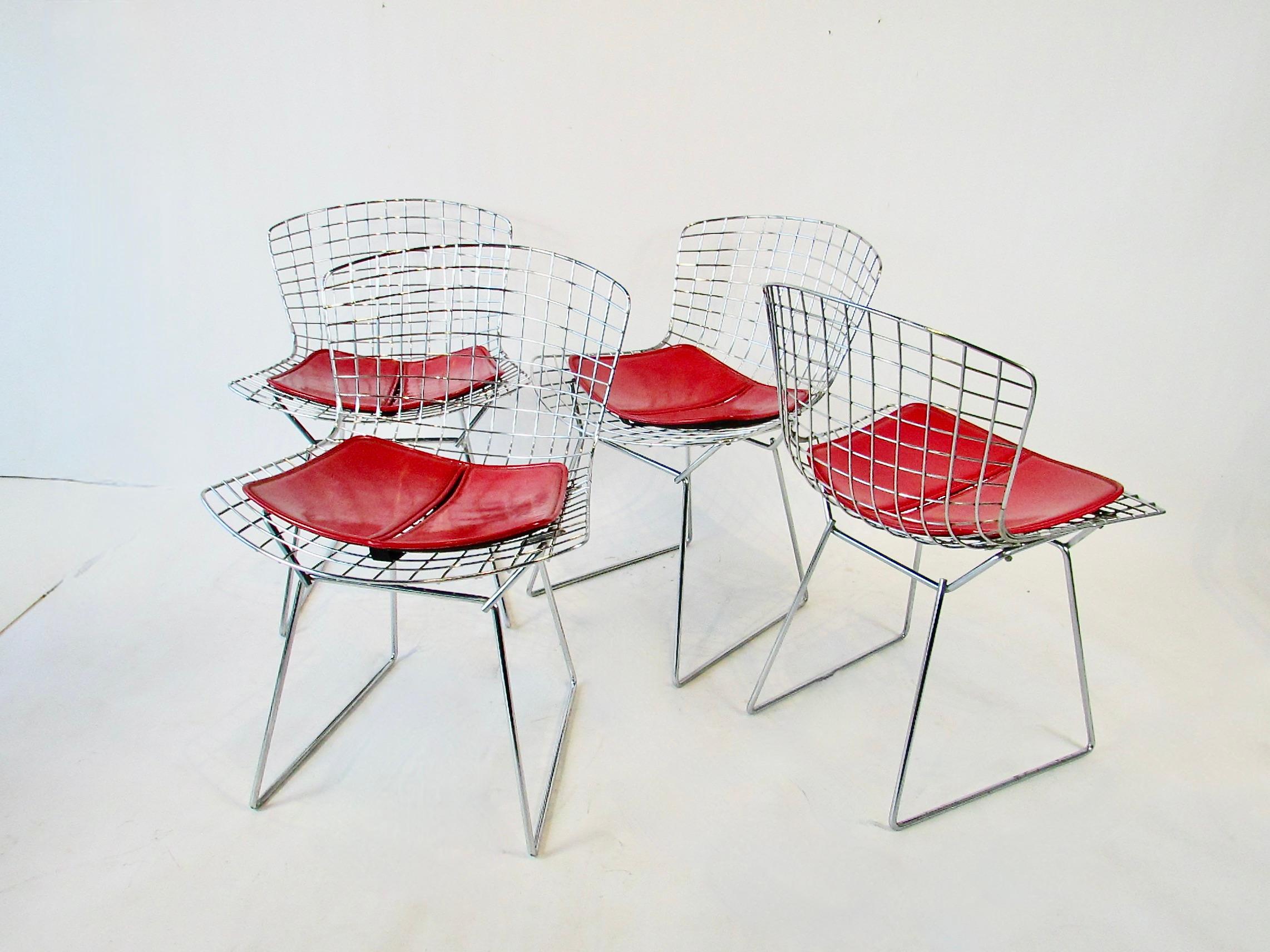 Set of four Harry Beroia chrome side or dining chairs . Welded steel rods form the seat supported on 3/8
