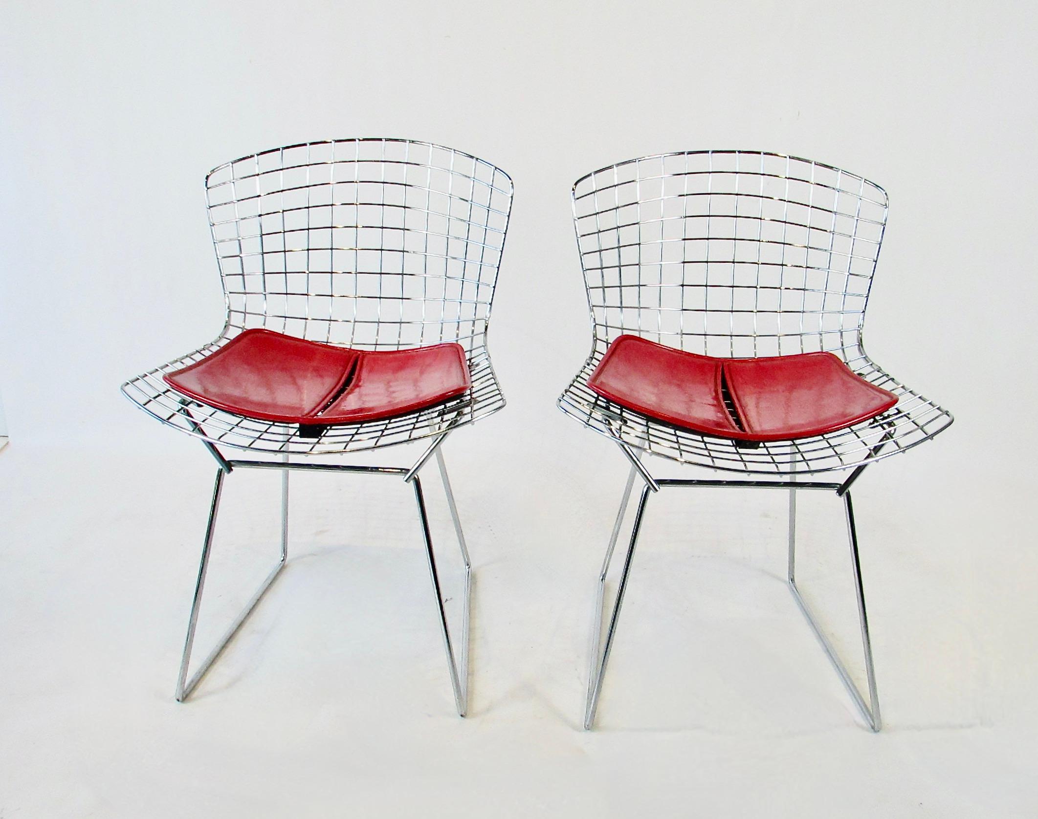 American Set of four Harry Bertoia for Knoll chrome dining chairs with deep red cushions
