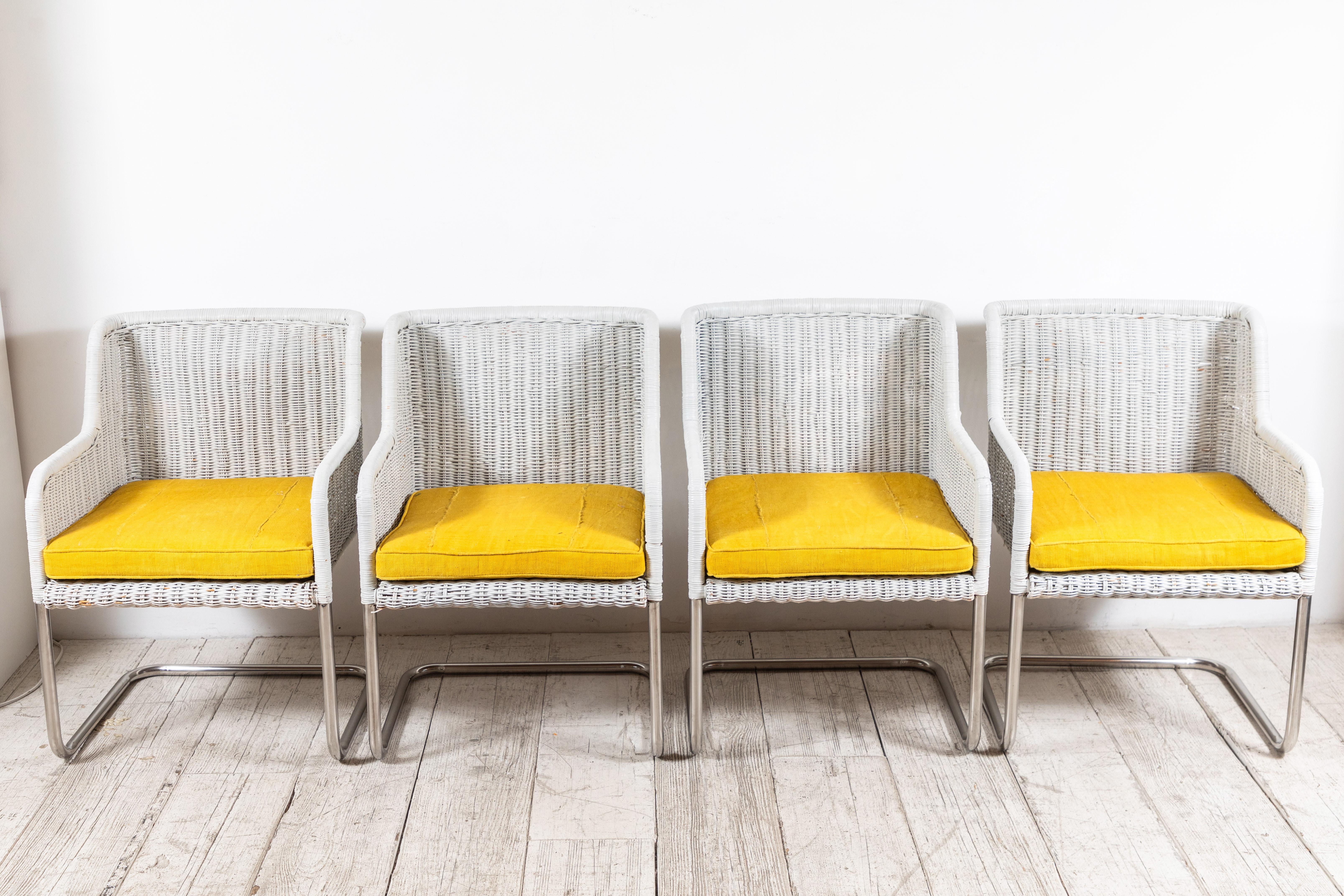 Set of four Harvey Probber style white painted wicker chairs with newly upholstered yellow mud-cloth seat cushions. 

   