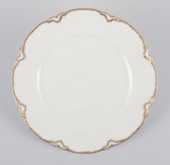 Set of four Haviland porcelain dinner plates with gold decoration, 1930s/40s