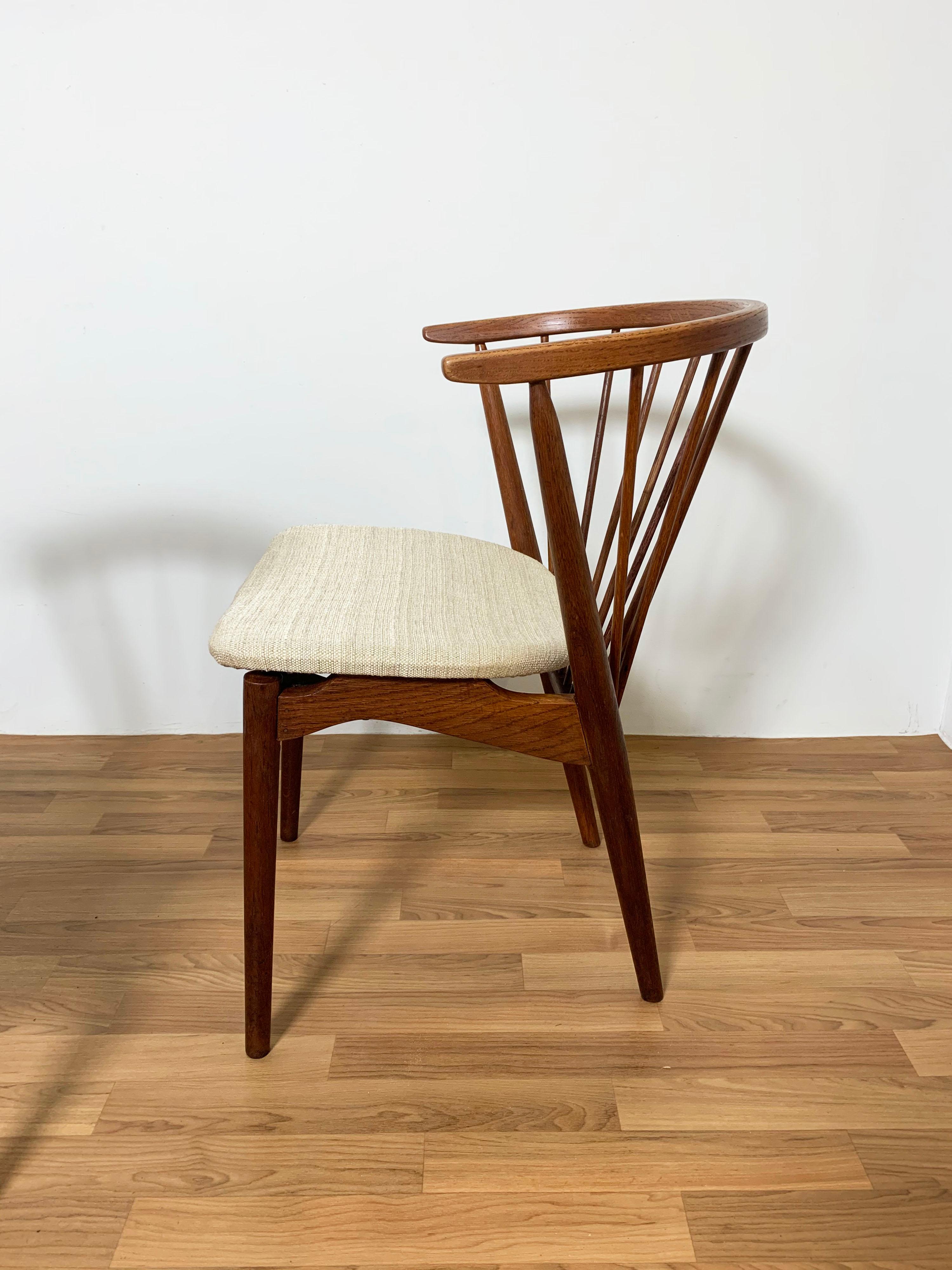 Set of four dining chairs designed by Helge Sibast for Sibast Mobler, Model No. 6, designed in 1953. Oak spindle back frames with newer upholstery.