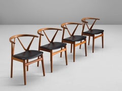 Set of Four Henning Kjaernulf Dining Chairs in Teak and Black Upholstery