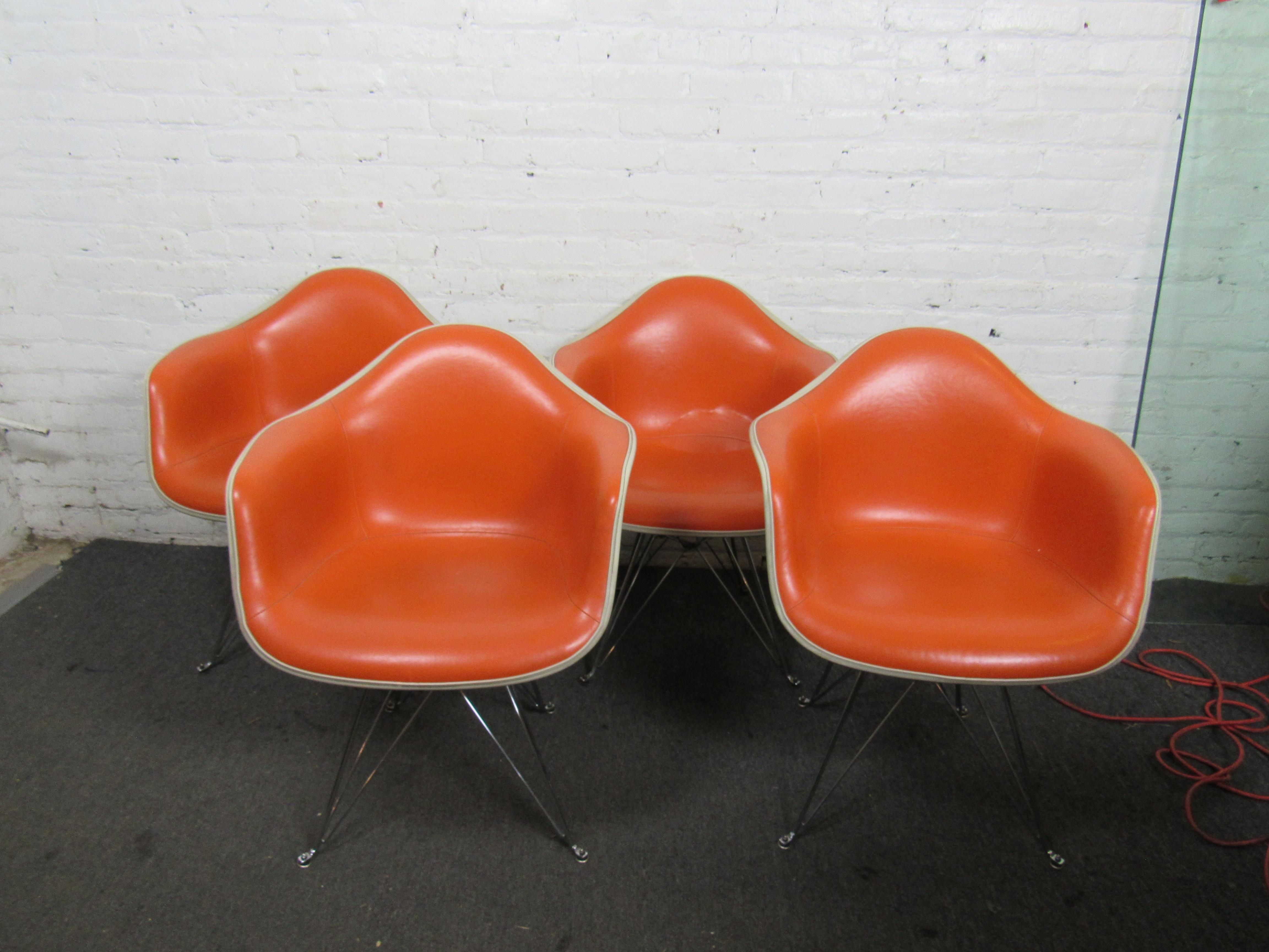 Vibrant set of four orange cream Herman Miller chairs. 
(Please confirm item location - NY or NJ - with dealer).
 