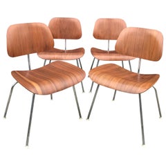 Set of Four Herman Miller Eames DCM Chairs in Walnut