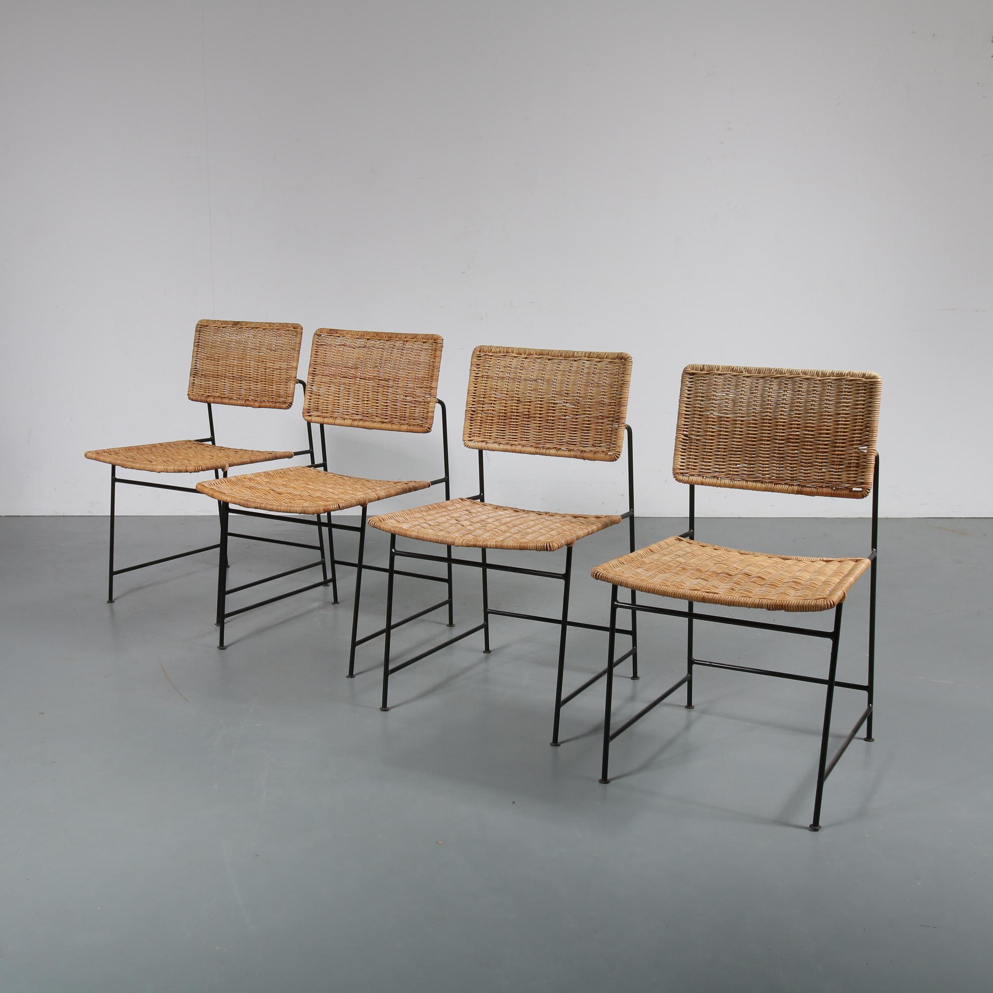 A beautiful set of four dining chairs by Herta-Maria Witzemann, model SW88, manufactured by Wilde + Spieth in Germany, 1954.

This amazing set has a unique, Minimalist design made of thin black lacquered metal with wicker seats and backs. The