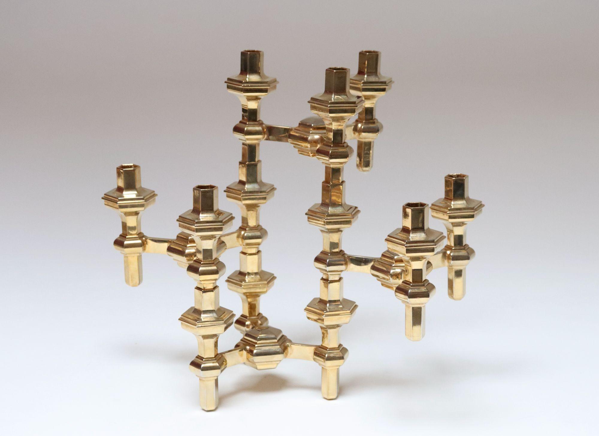 Set of four stackable brass candlesticks designed by Nagel Geschenke (ca. 1960s, Germany).
Nagel Geschenke designs all share the hexagonal form motif, though these stackable, three-candle candelabra examples are very uncommon for the brand (a form