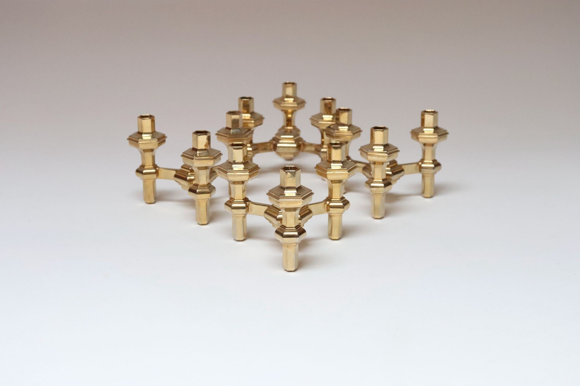 Set of Four Hexagonal-Form Stackable Brass Candleholders by Nagel Geschenke For Sale