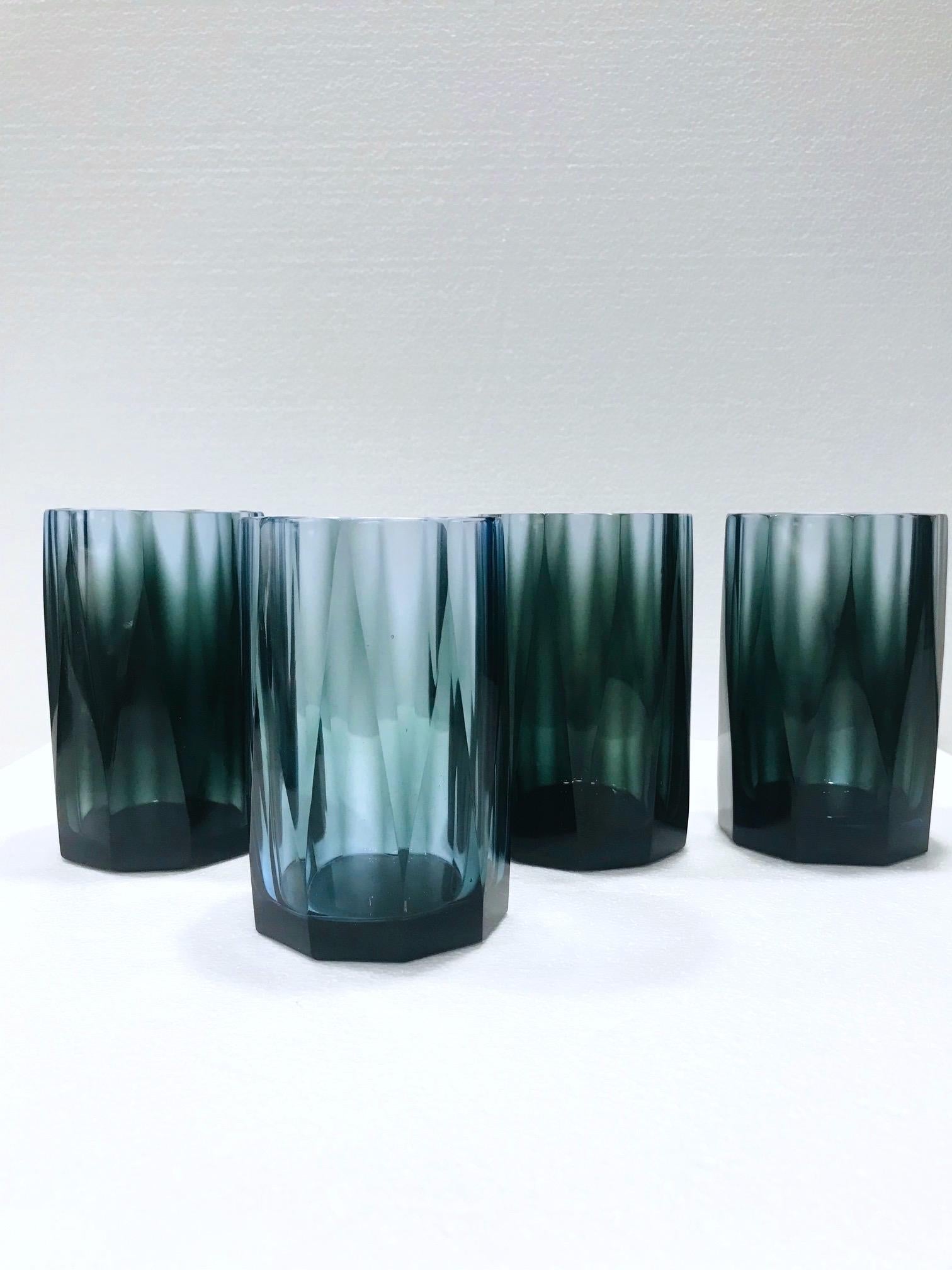 Vintage hand blown water glasses or double old fashioned barware glasses with faceted prism design. Each glass is individually handcrafted, creating a unique blend of colors in gradient smoked blue and gray. Hollywood Regency design making a chic