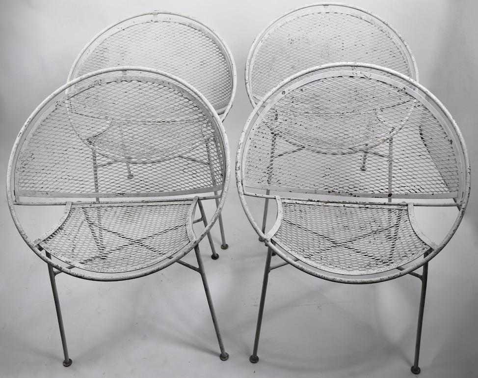Set of four Hoop, or Radar chairs designed by Maurizio Tempestini for Salterini.
All four are in very good original condition, showing only cosmetic wear to the finish, normal and consistent with age. The chairs are dining height ( Seat H 17 inch )