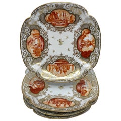 Set of Four Orange and Gilt Painted Plates