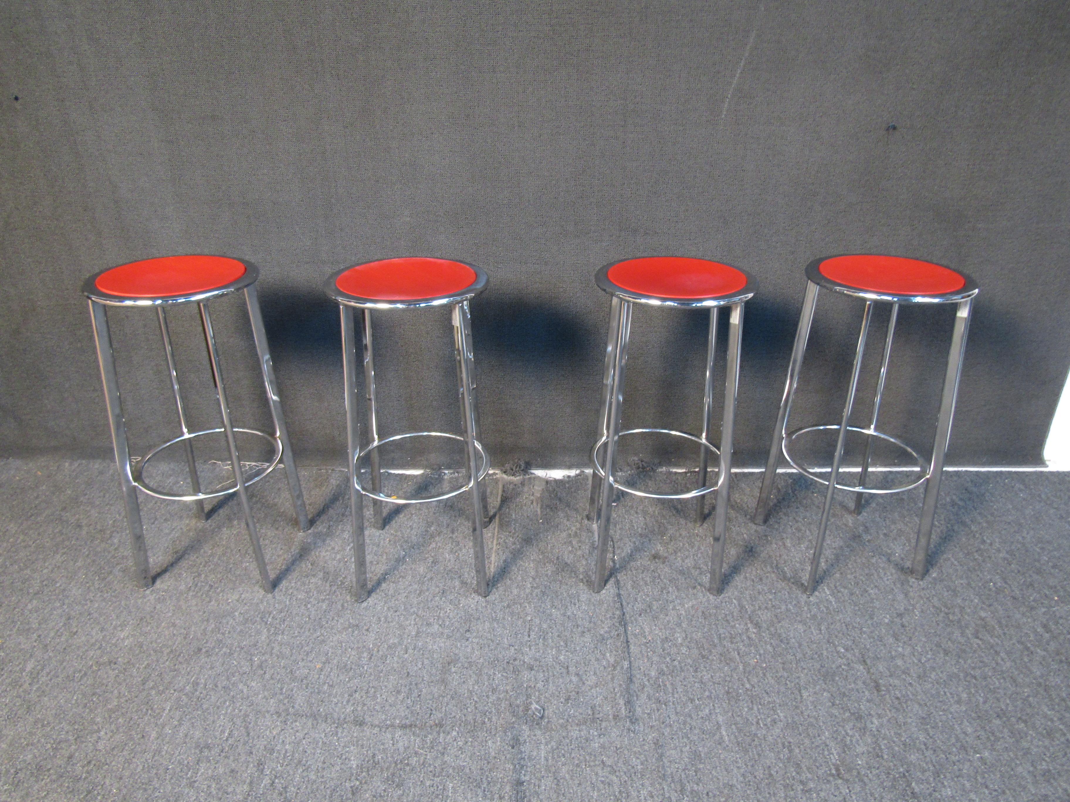 This set of four barstools by Metalmobil feature chrome frames complemented by bright red wooden seats, elevating the minimal design of these vintage stools. Please confirm item location with seller (NY/NJ).