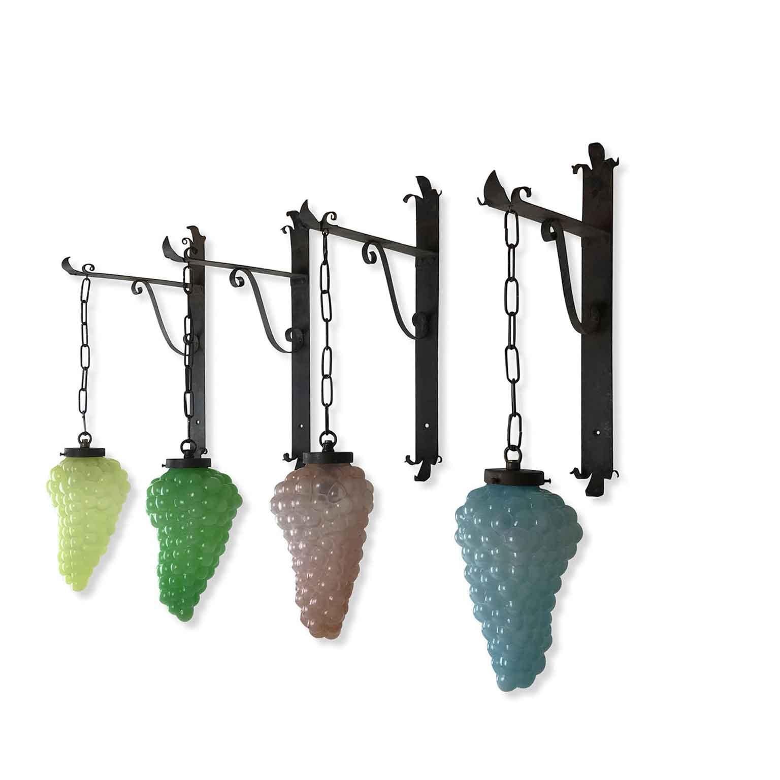 A set of four glass grape cluster wall lights, four colored glass bunches, green, rose, blue and lime yellow sconces, Italian wine theme wall lamps with wrought Iron brackets realized in Italy around 1960 circa.
if you are a collector of anything to