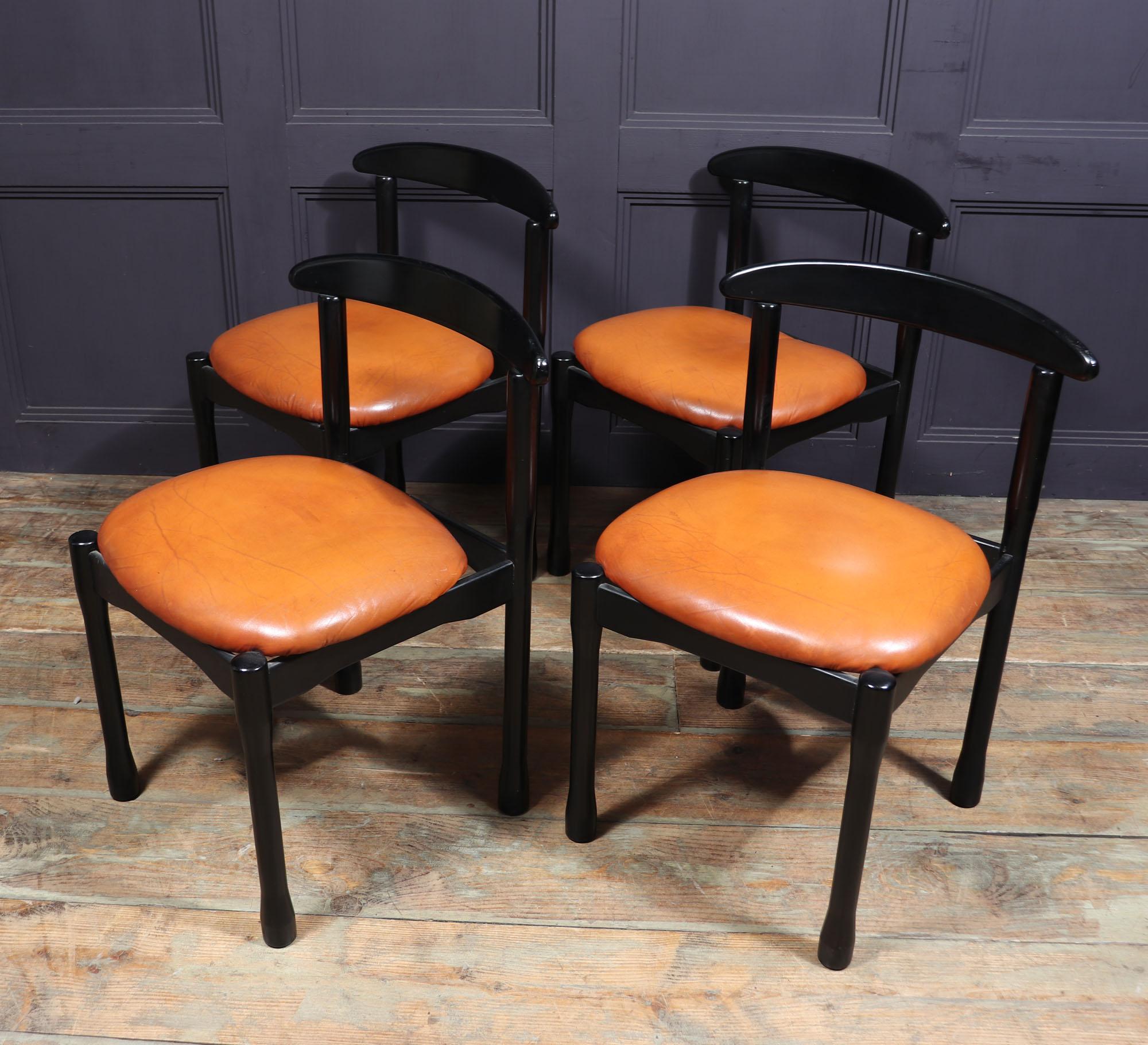 Mid century Italian dining chairs
This set of four Italian dining chairs is an iconic piece of mid-century design by renowned architect and designer Vico Magistretti. Crafted from ebonised wood, these striking chairs feature a curved backrest that