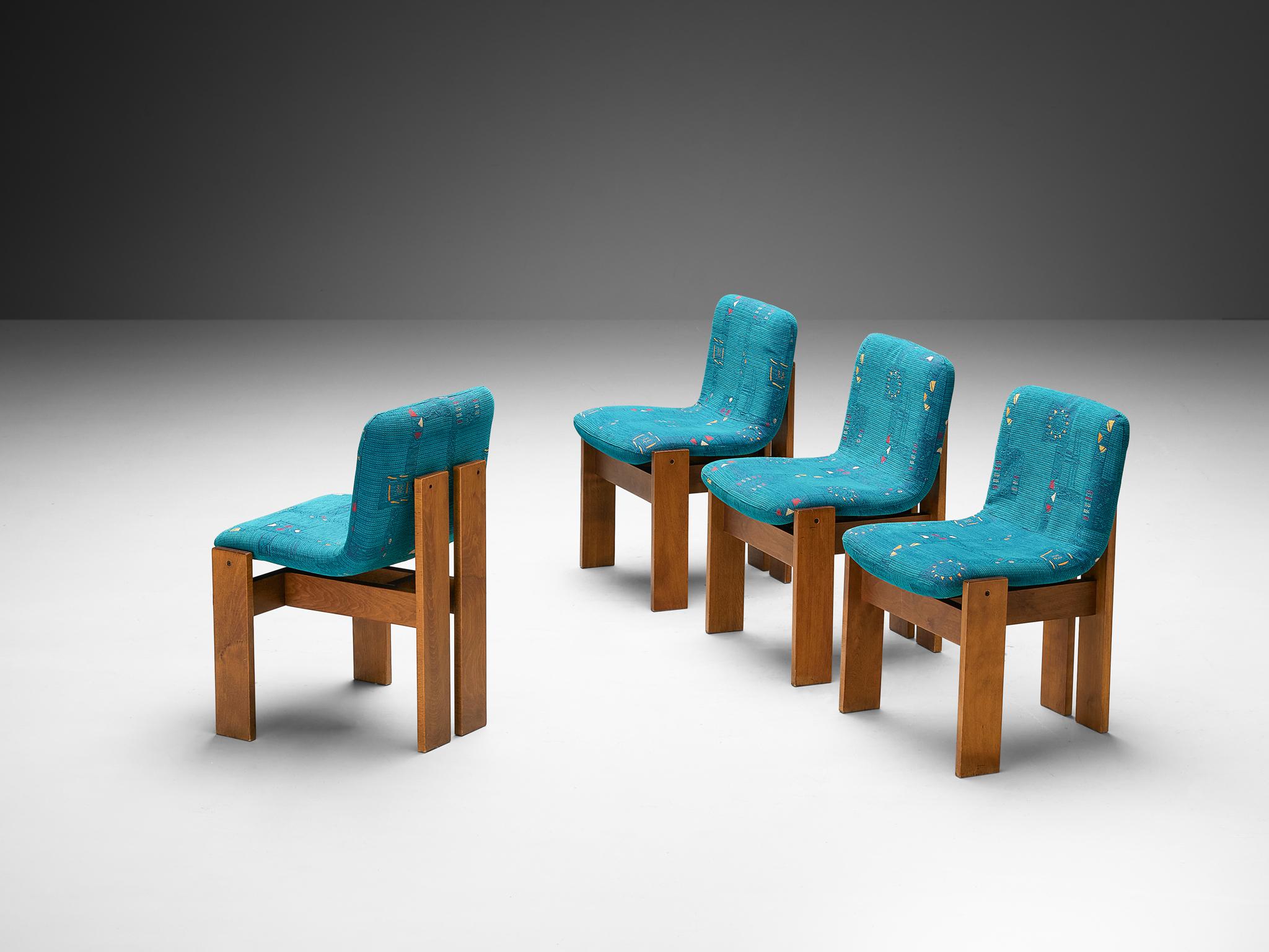 Set of four dining chairs, wood, fabric, Italy, 1960s 

These Italian-made dining chairs echo the distinct styles of Augusto Savini’s 'Pamplona' chair (1965) and Afra & Tobia Scarpa's 'Pigreco' chair (1959-1960), but stand out with unique design