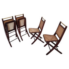 Set of four Italian folding chairs wood brass Vienna straw, 1970s