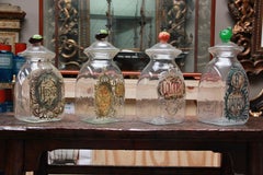 Set of Four Italian Glass Apothecary Jars with Fruit Finials