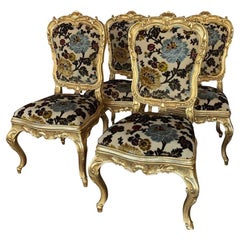Set of Four Italian Hand-Carved Gilded Chairs with Vintage Floral Upholstery