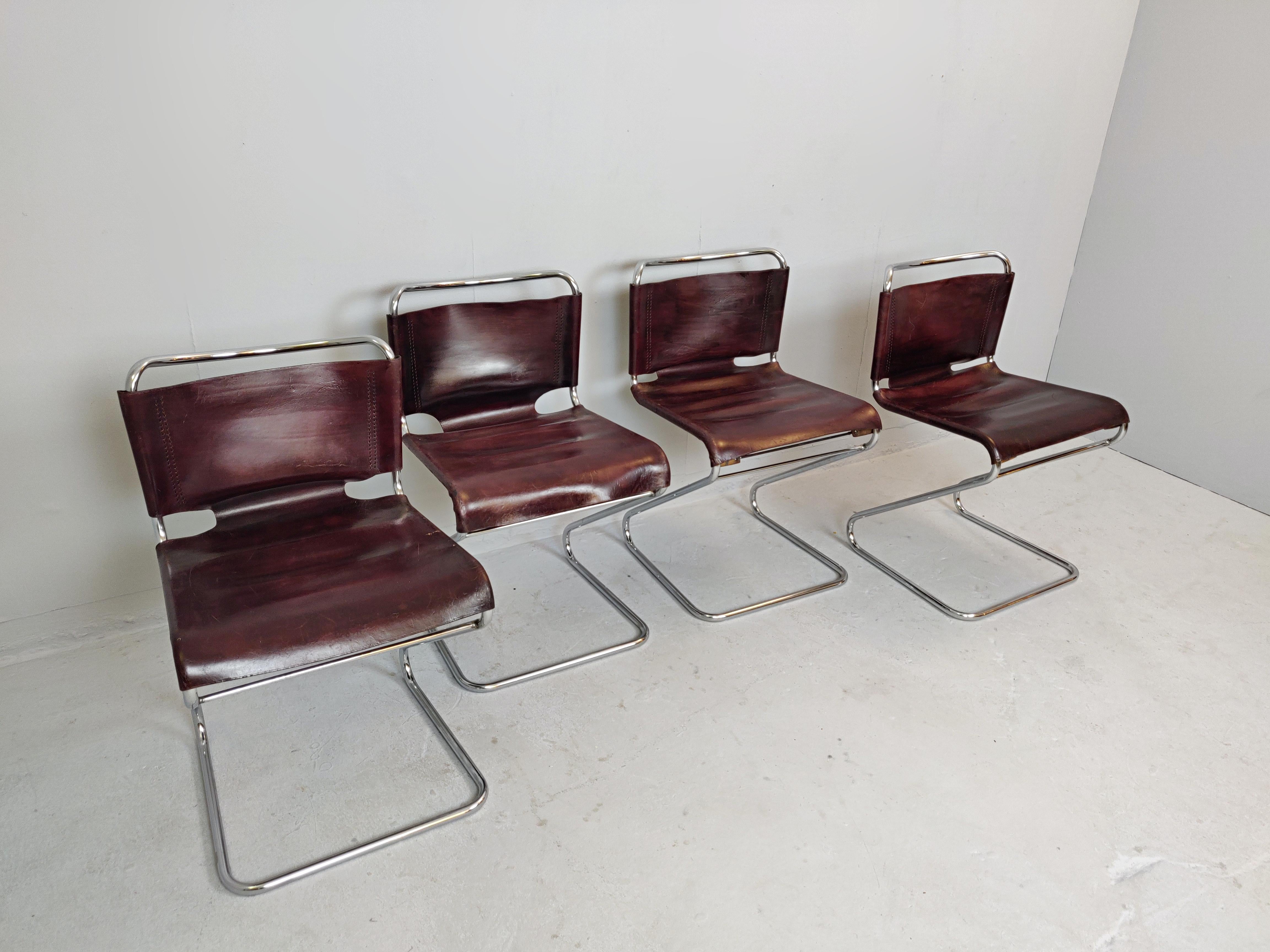 Set of four Italian leather and tubular chairs.