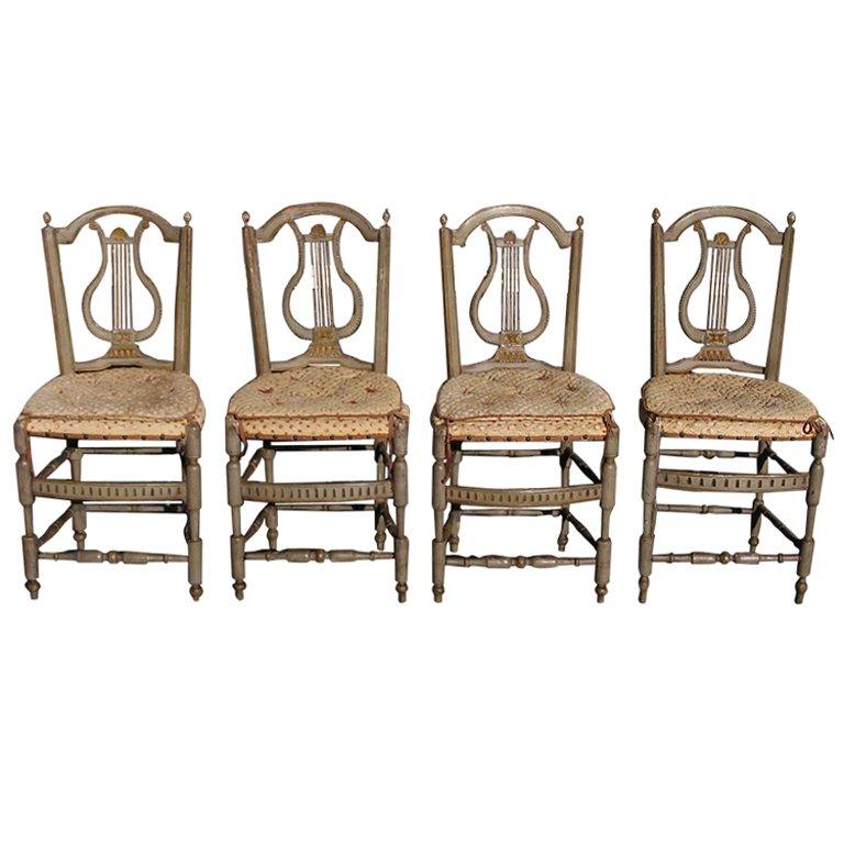 Set of Four Italian Lyre Back Painted and Gilt Side Chairs For Sale