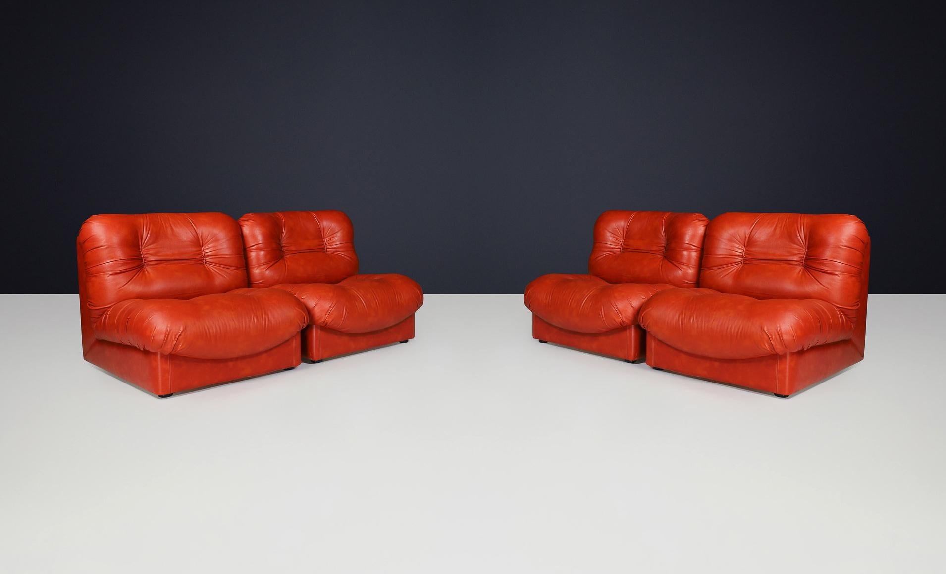Set of Four Italian Mid-Century Modern Leather Lounge Chairs, 1970s

Description:
A set of four original Italian lounge chairs from the 1970s, exemplifying classic mid-century modern design. These chairs feature a low-slung, modular silhouette with