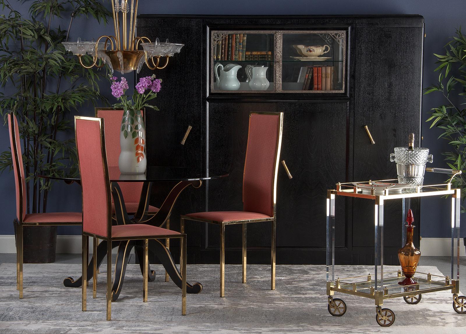 A vintage set of four high-backed Italian brass chairs, circa 1960s. The streamlined frame is constructed of brass plated square tubes. The seat form is wider at the front, angling in towards the back, and the 26