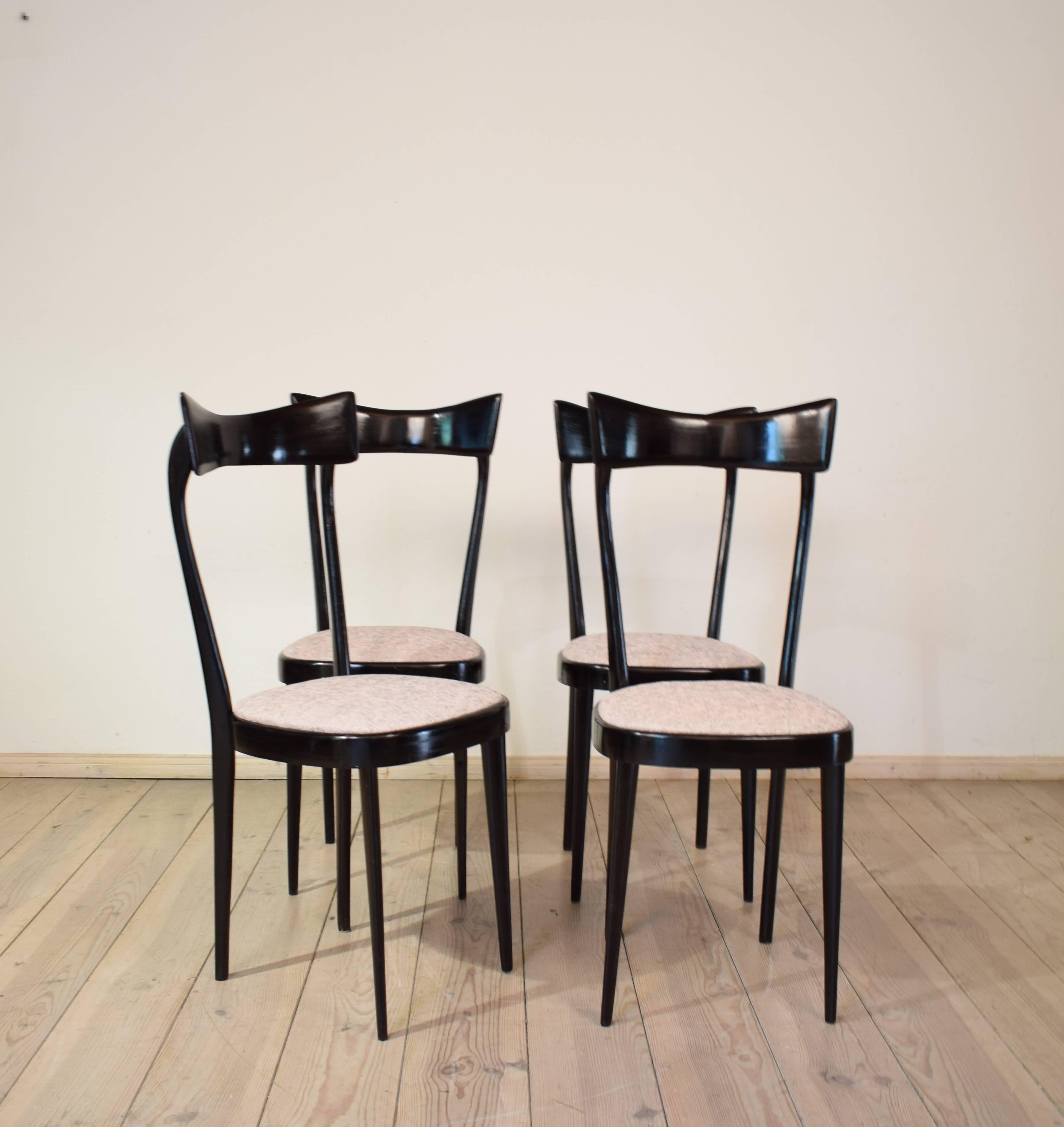 This Set of four midcentury dining chairs where made in Italy in the 1950s.
They are made in the manner of Ico Parisi which was a designer and architect.
The chairs have a very unique shape.
They and are made out of ebonized beech and the