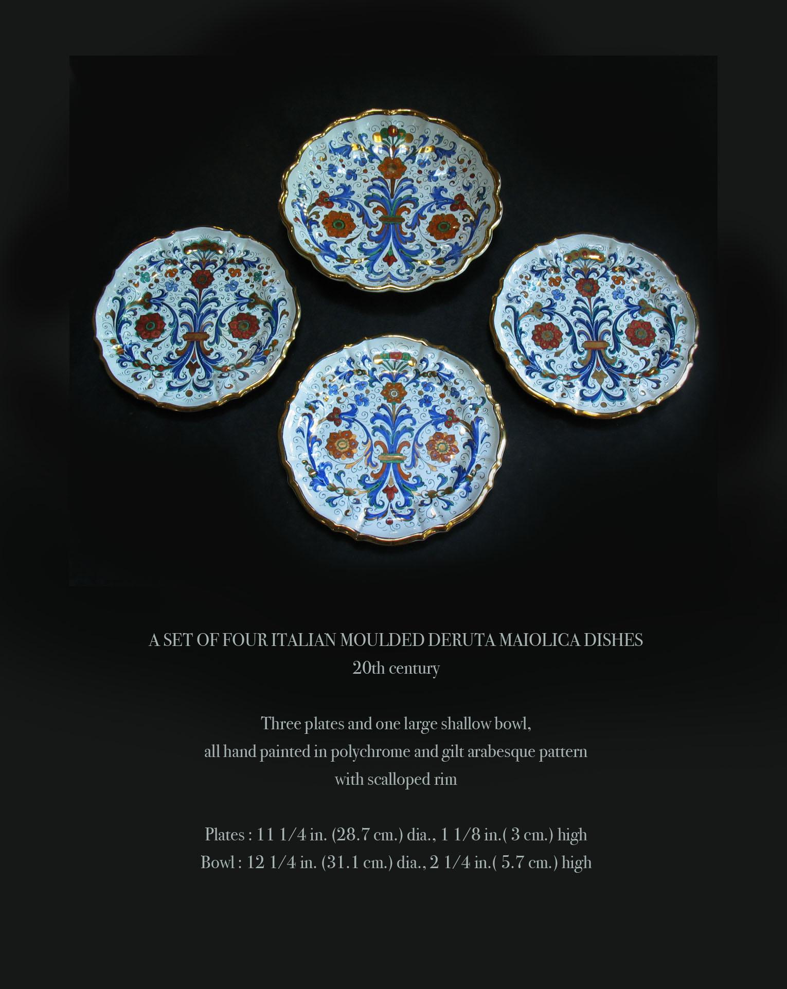 A set of four Italian molded Deruta Maiolica/Majolica dishes
20th century

Three plates and one large shallow bowl,
all hand painted in polychrome and gilt arabesque pattern
with scalloped rim.

Plates: 11 1/4 in. (28.7 cm.) dia., 1 1/8 in.(3