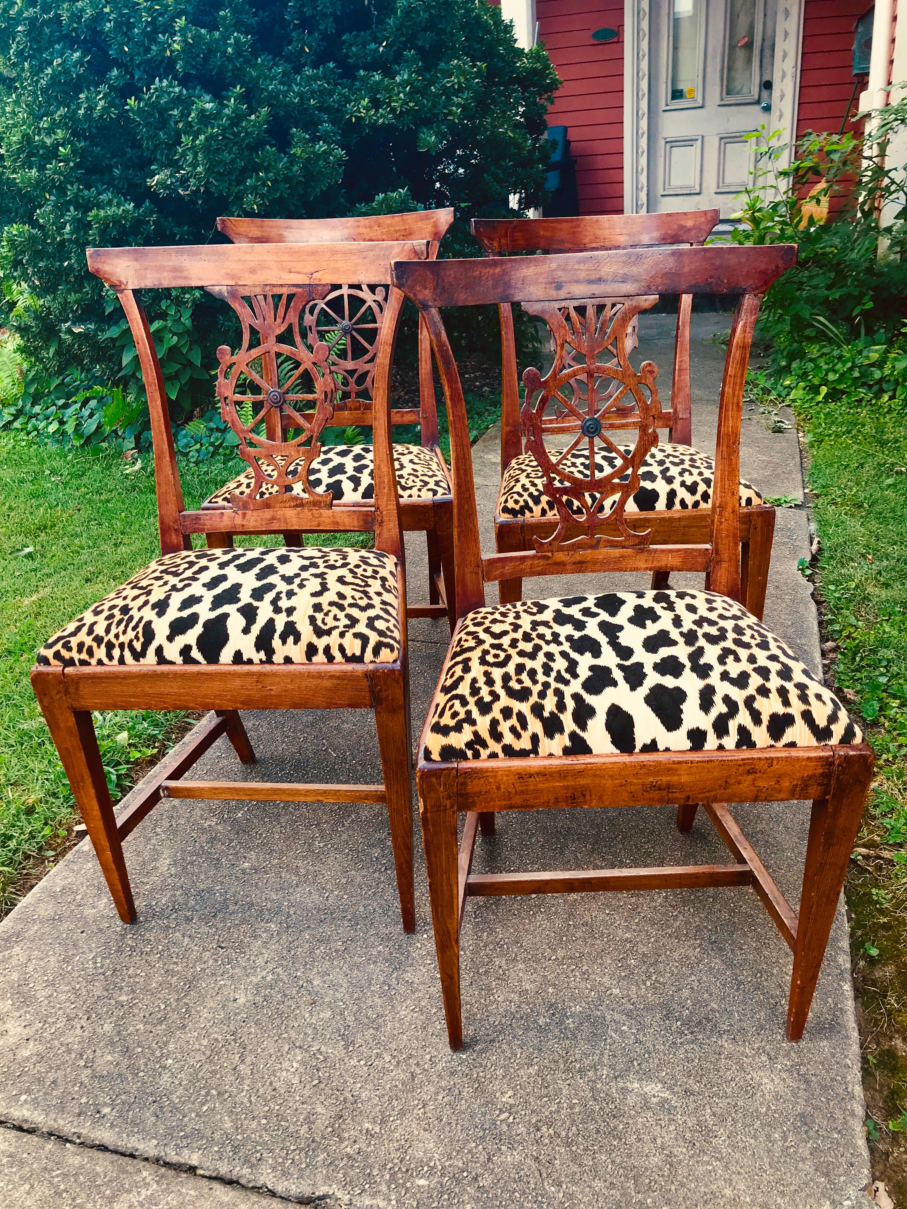 In leopard or cheetah velvet. All four in hand carved and peg constructed Directoire frames and of slight Klismos form. Pretty well untouched (other than new leopard velvet seat covering), no later screws or glue blocks and still all four are