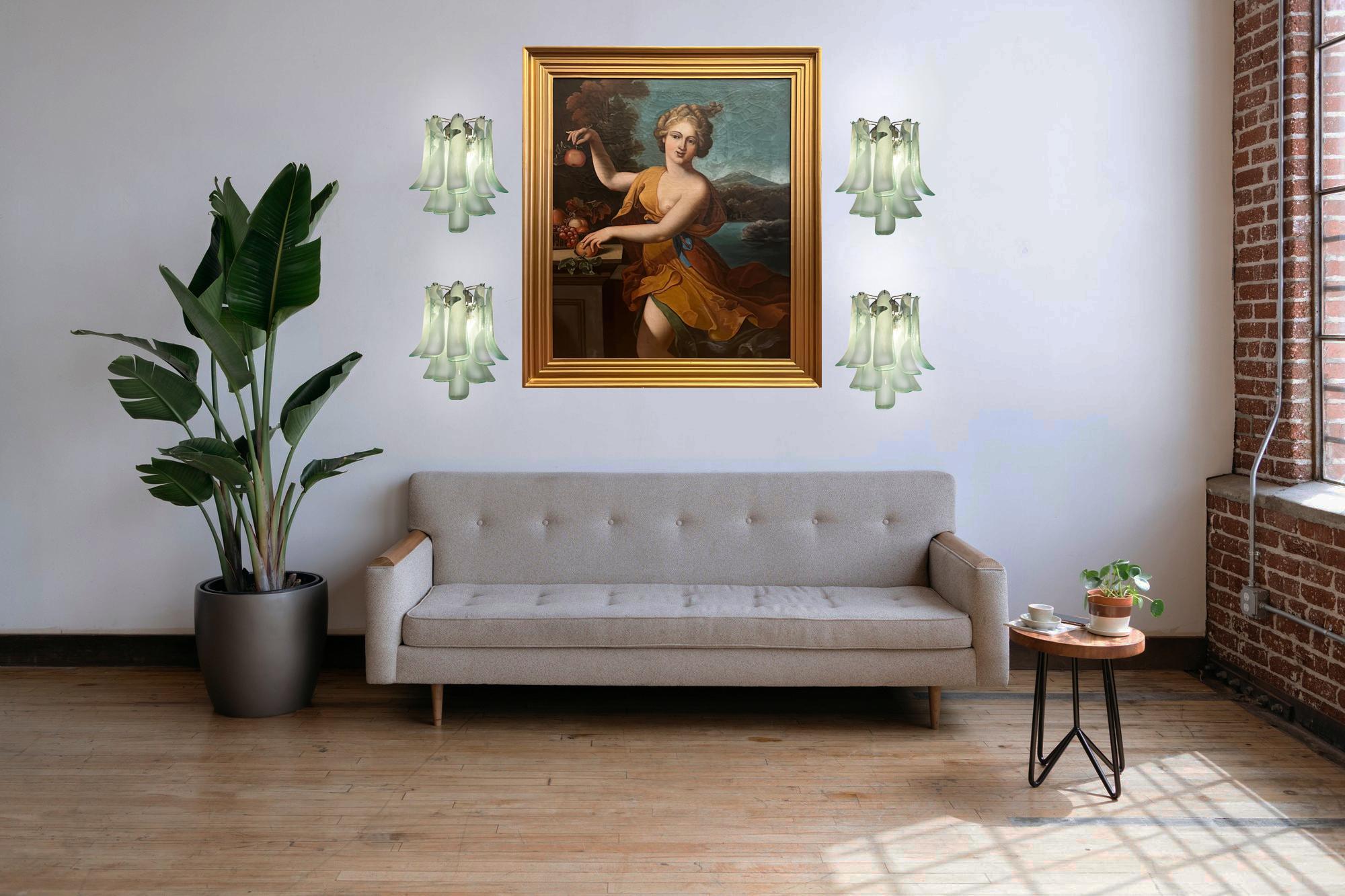 Set of four Vintage Italian Murano sconces in the manner of Mazzega. Wall lights have 10 turquoise and white “lattimo” glasses (for each applique) in a nickel-plated metal frame.
Period: late XX century
Dimensions: 16,50 inches (42 cm) height; 13,80