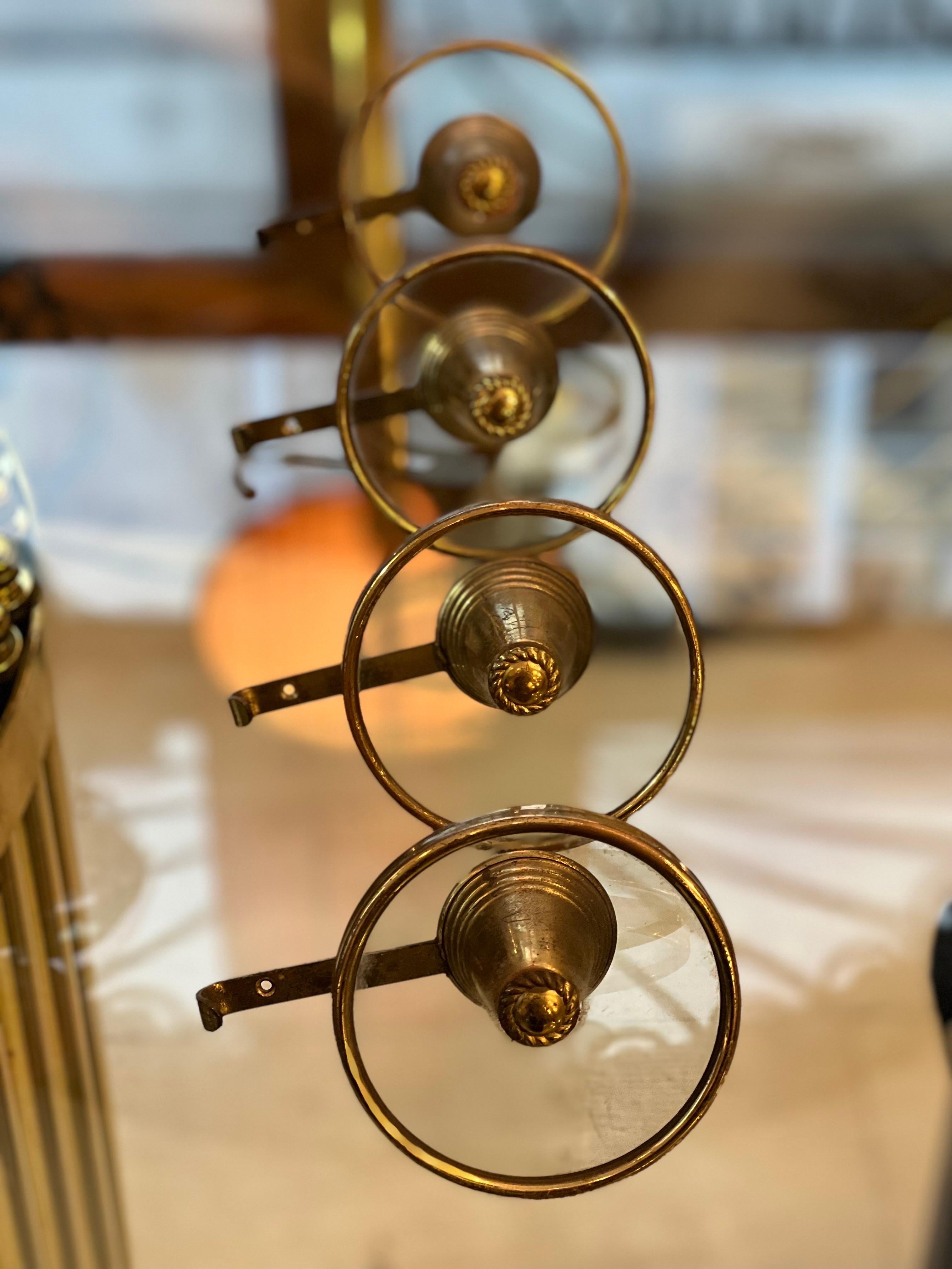 Set of Four Italian Vintage Brass and Glass Round Coat Hangers.