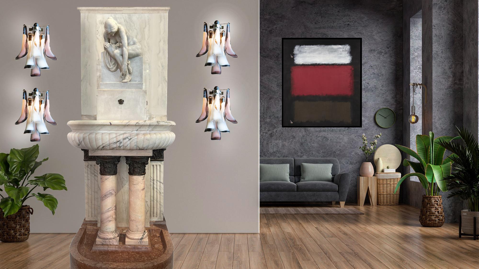 Set of four vintage Italian Murano appliques. Wall lights have 6 white and lattimo glass petals (for each applique) in a chrome frame.
Period: 1980s
Dimensions: 17.30 inches (44 cm) height; 13 inches (33 cm) width; 7.10 inches (18 cm) depth from the